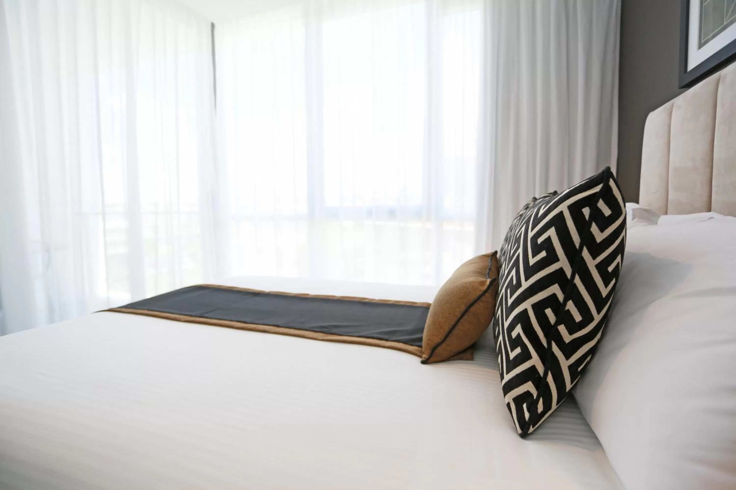 Bed in Alex Perry Hotel & Apartments