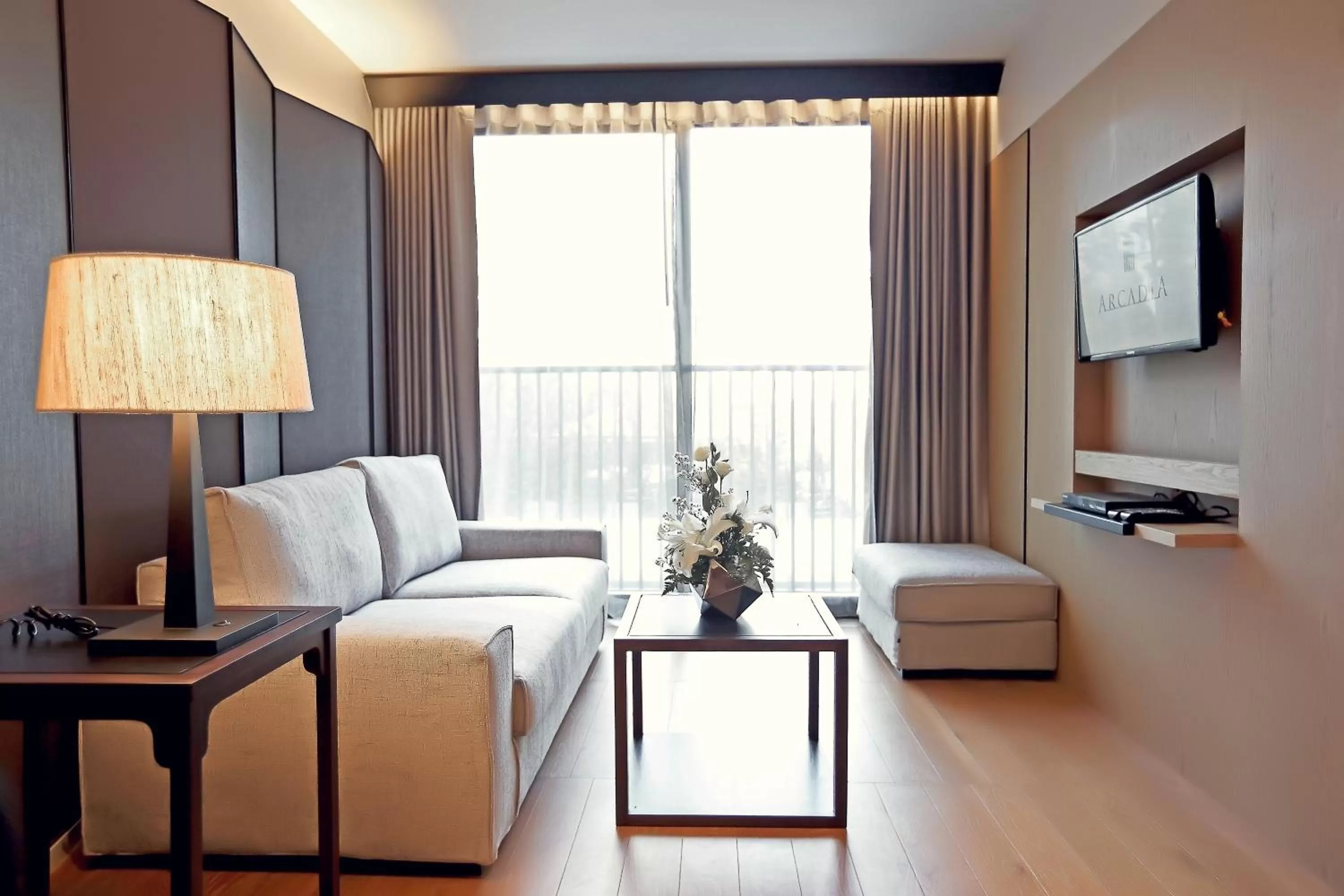Living room in Arcadia Suites Bangkok
