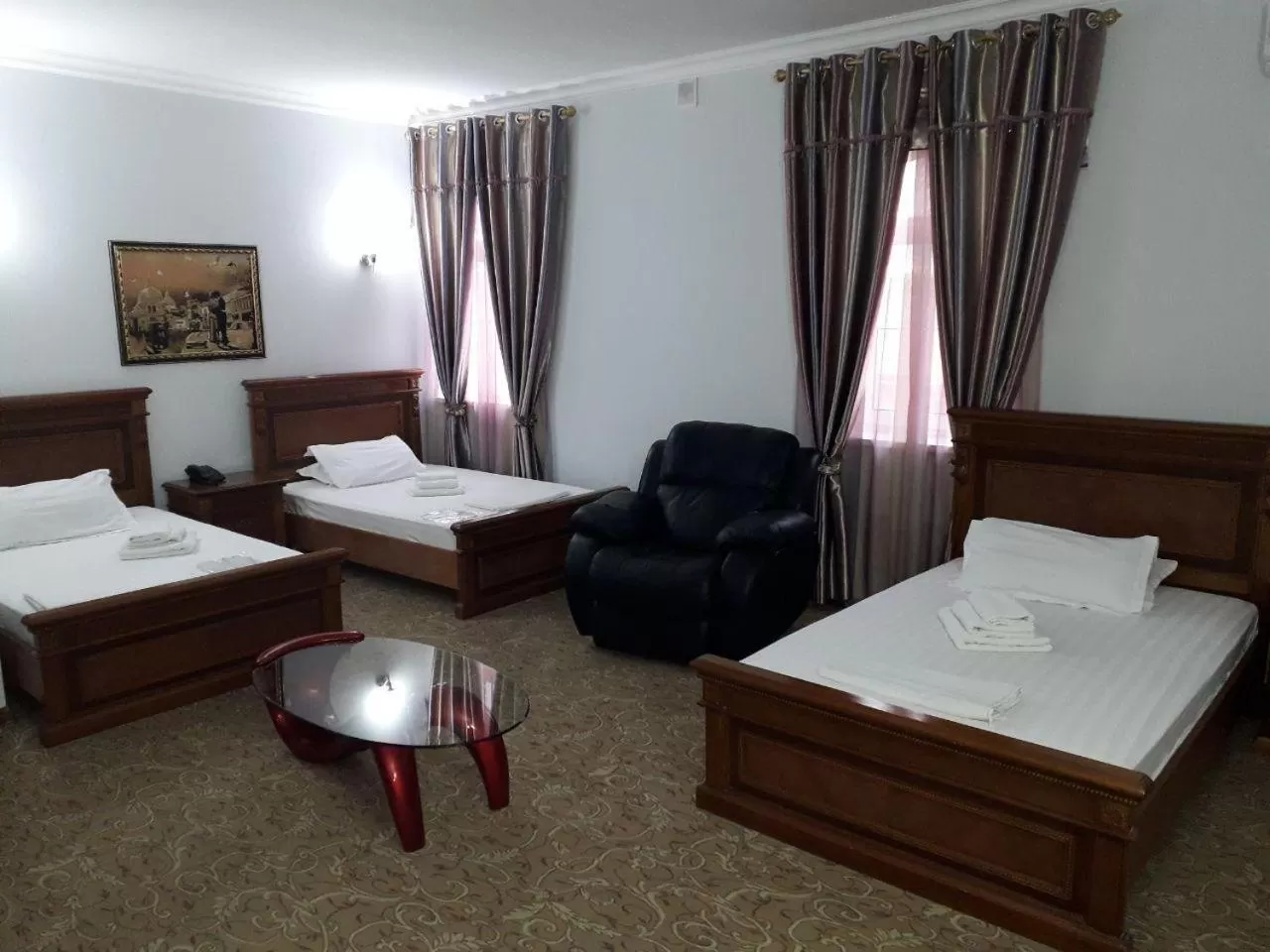 Bed in Maximum Hotel