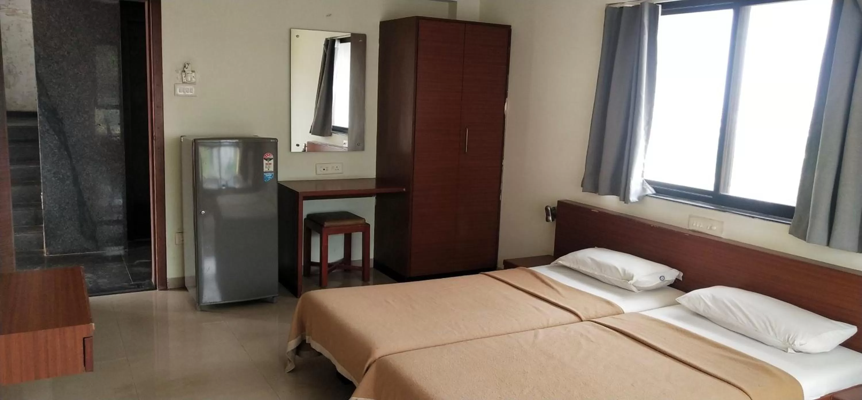 Bed in Hotel Sumanchandra Suites