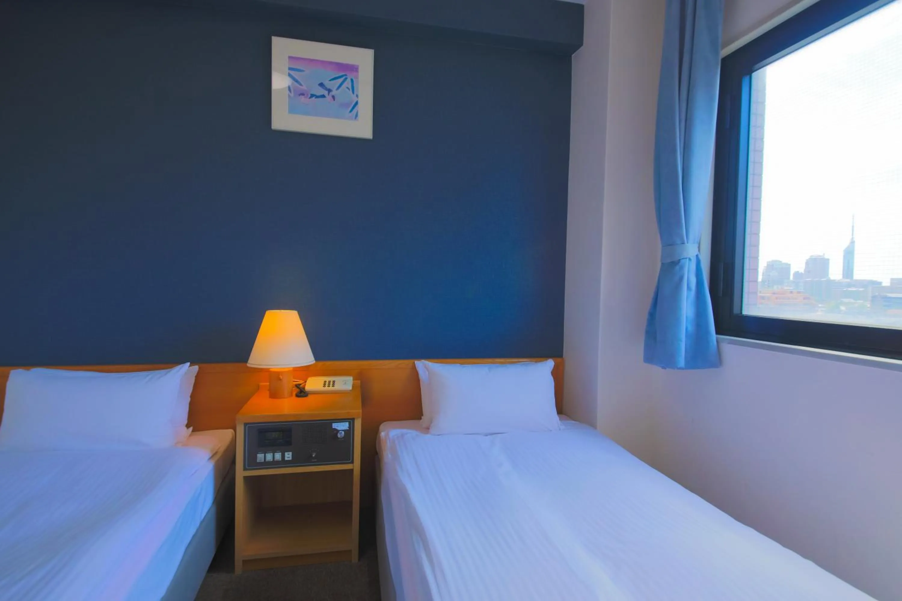 Bed in Heiwadai Hotel 5