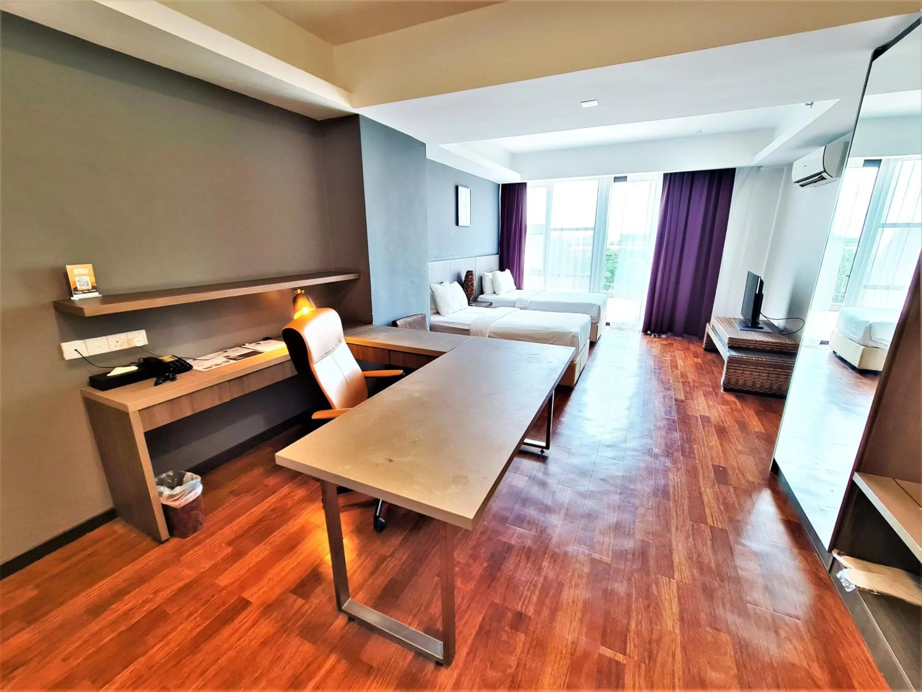 Seating area, Bed in Nexus Regency Suites & Hotel