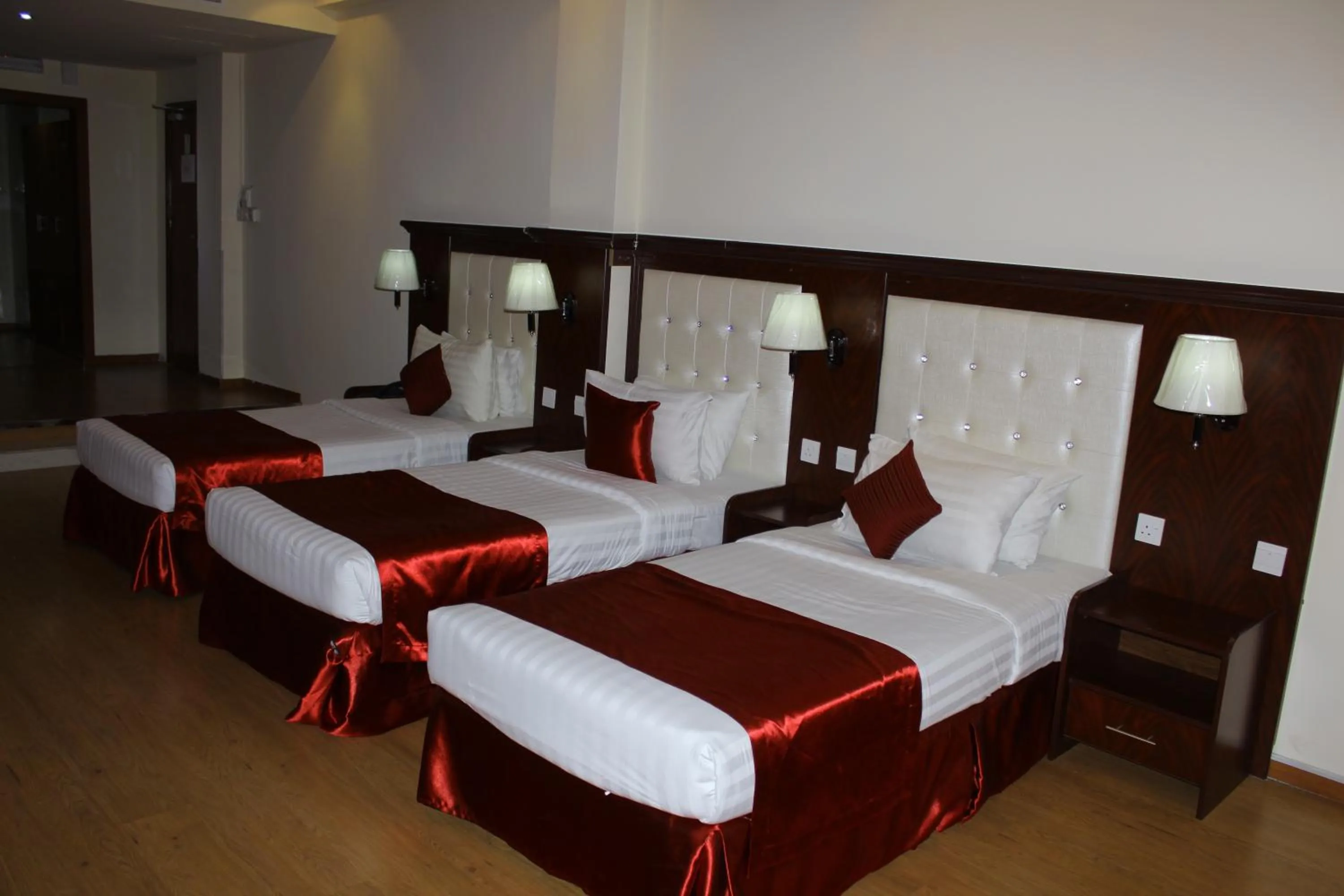 Bed in Grand Nova Hotel