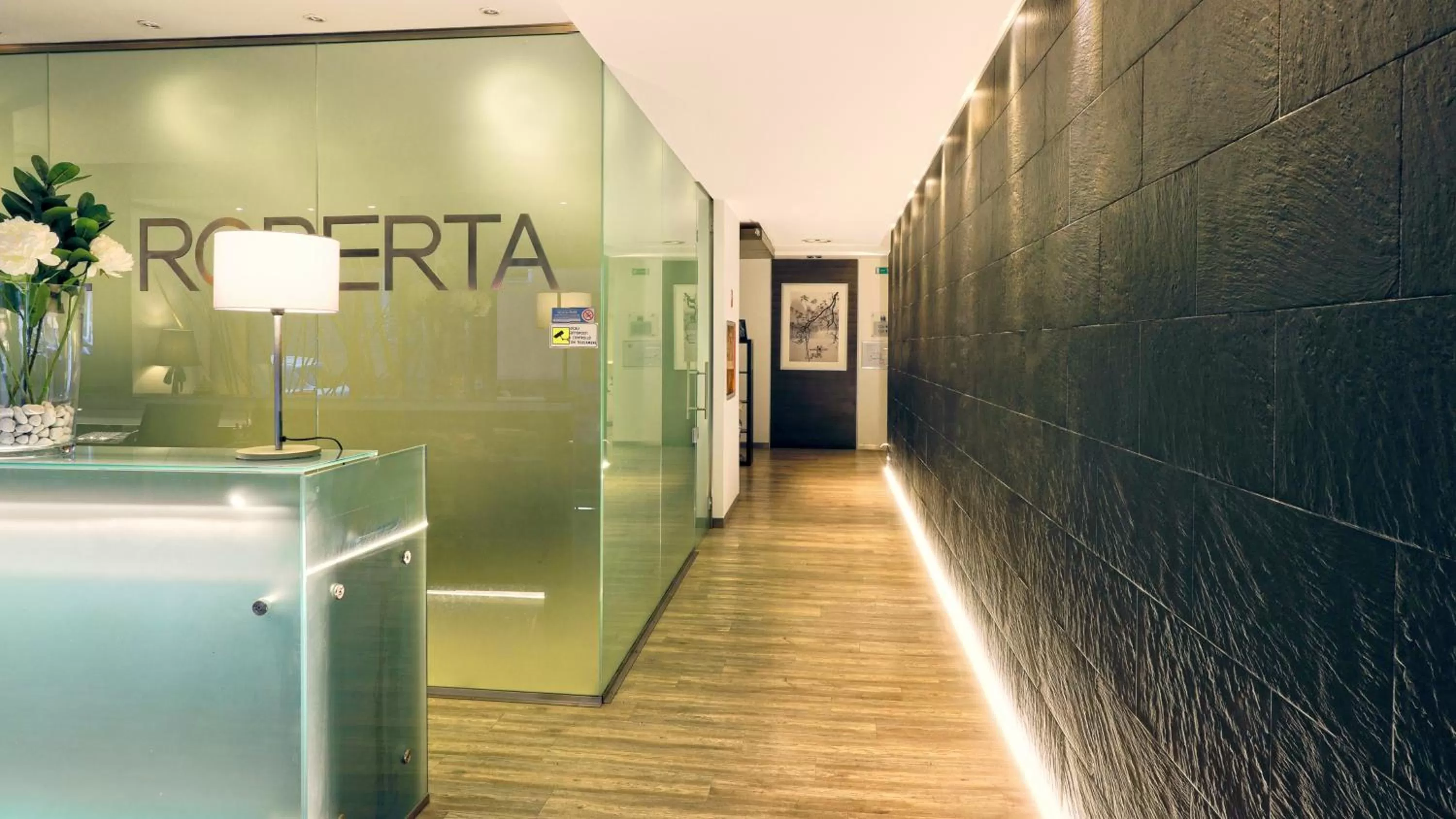 Property logo or sign in Hotel Roberta