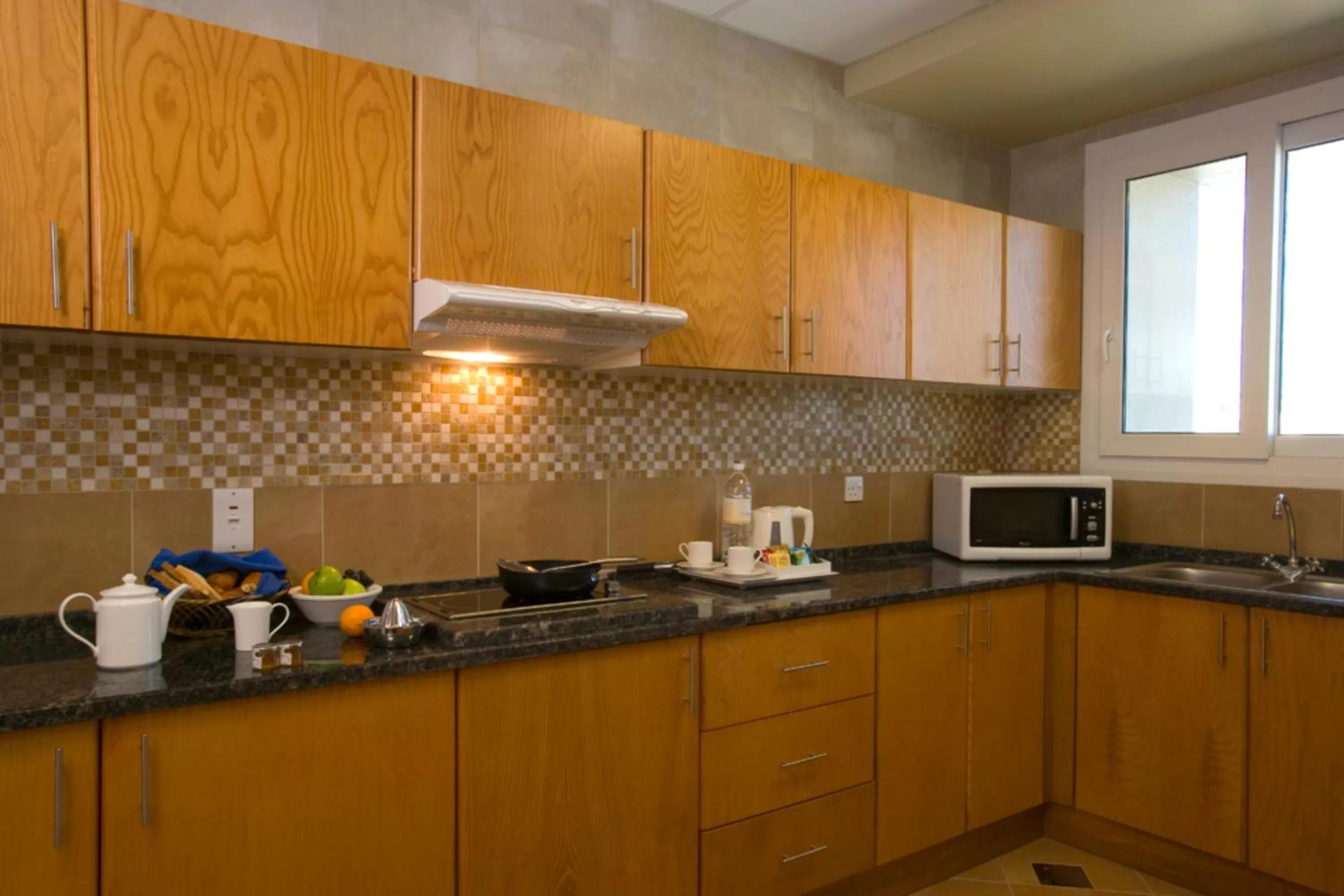 Kitchen or kitchenette in Al Khoory Hotel Apartments Al Barsha