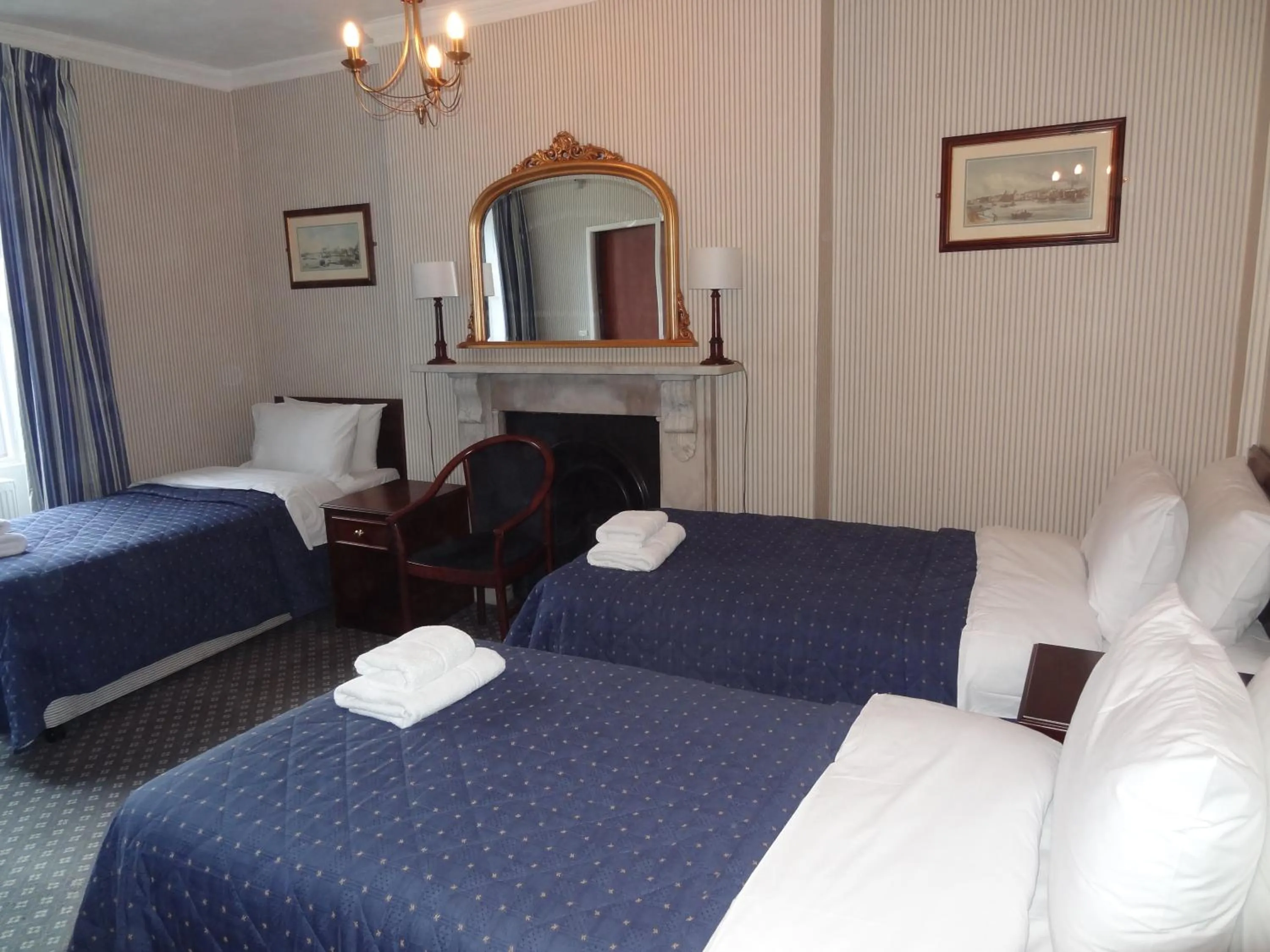 Bed in Regency House Hotel