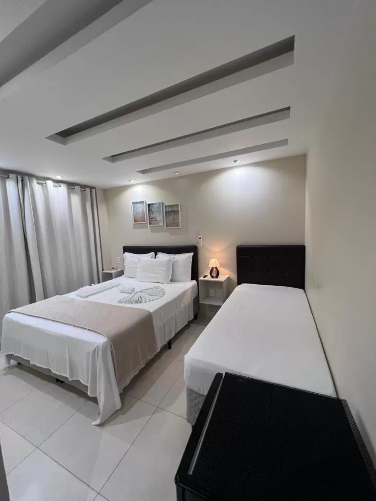 Bed in Pousada Arraial Tropical