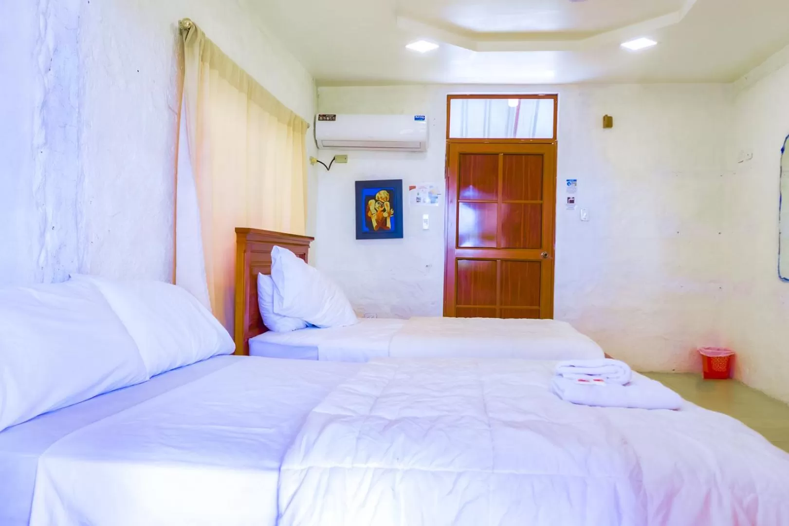 Bed in Royal Galápagos Inn