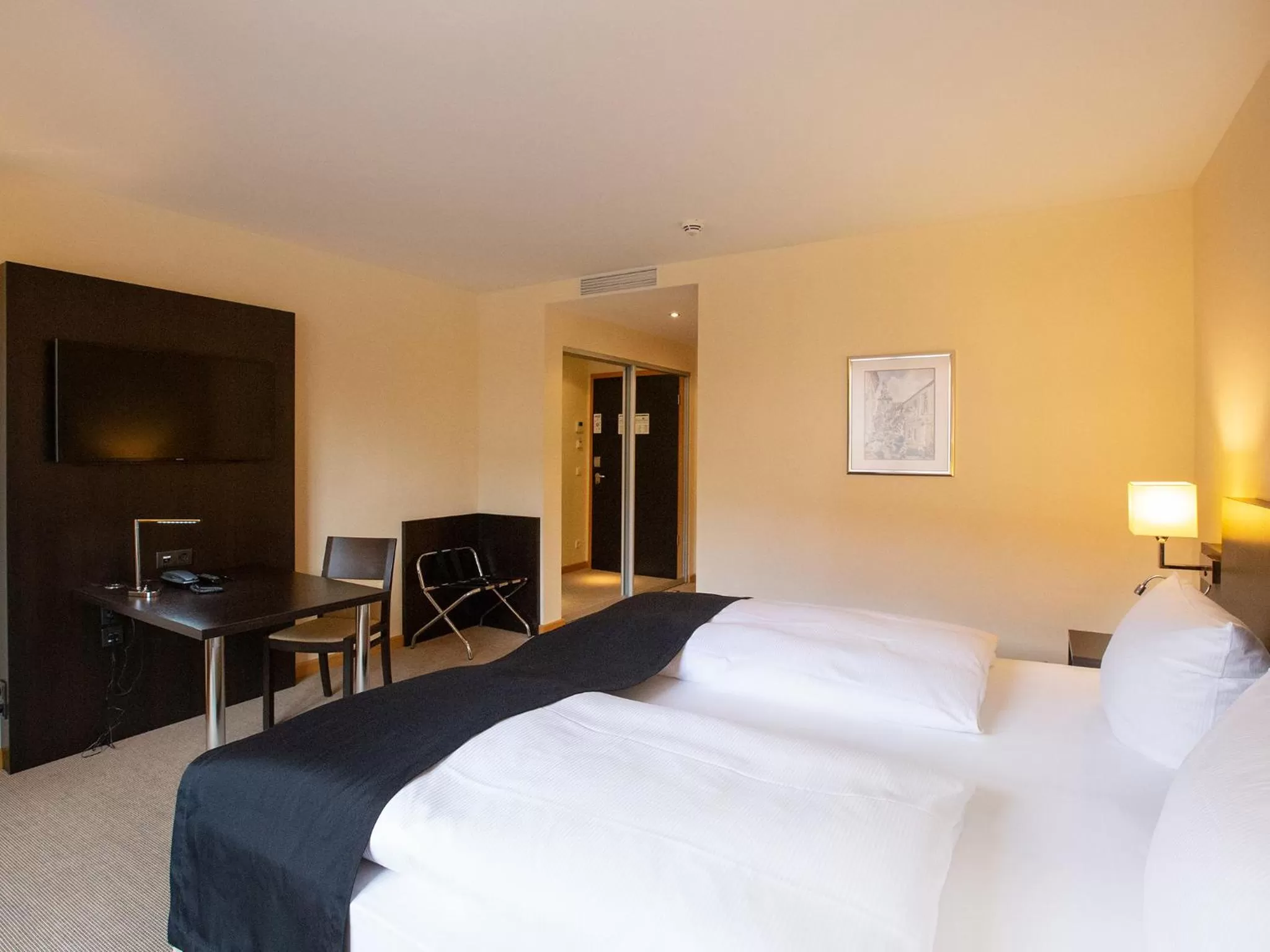 Photo of the whole room, Bed in DORMERO Hotel Altes Kaufhaus Lüneburg