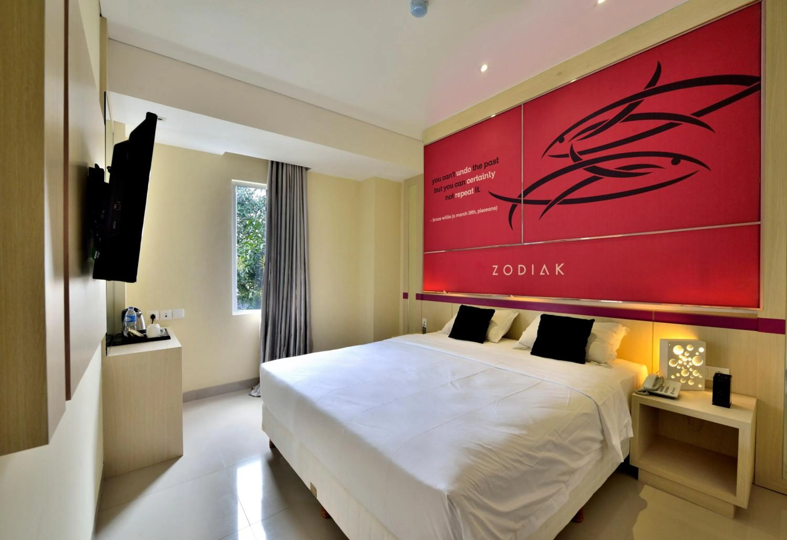 Bed in Zodiak Kebon Kawung by KAGUM Hotels