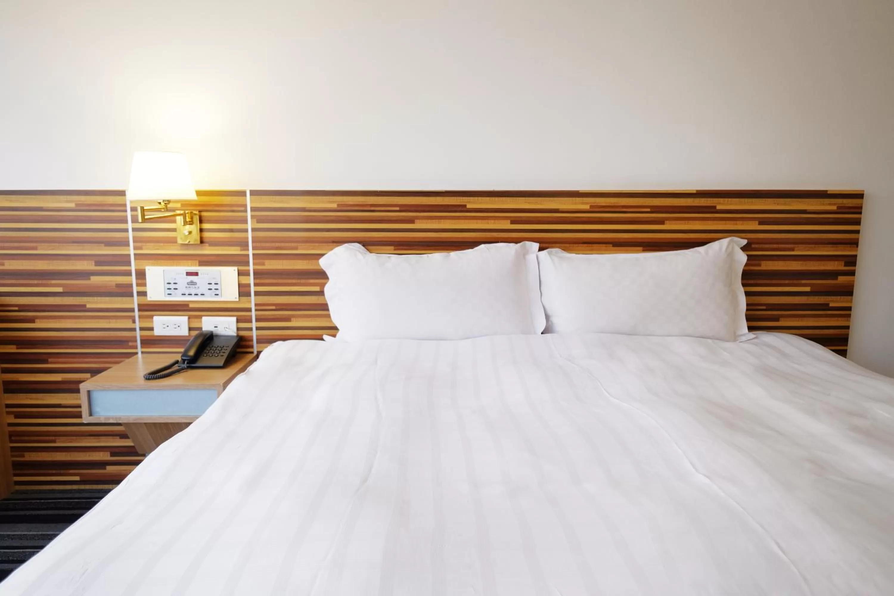 Bed in Dynasty Hotel