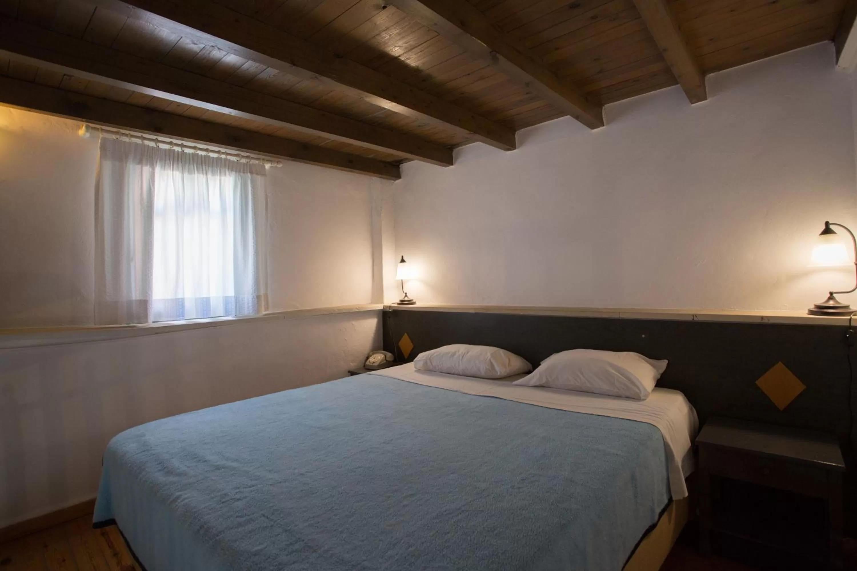 Bed in Nostos Hotel