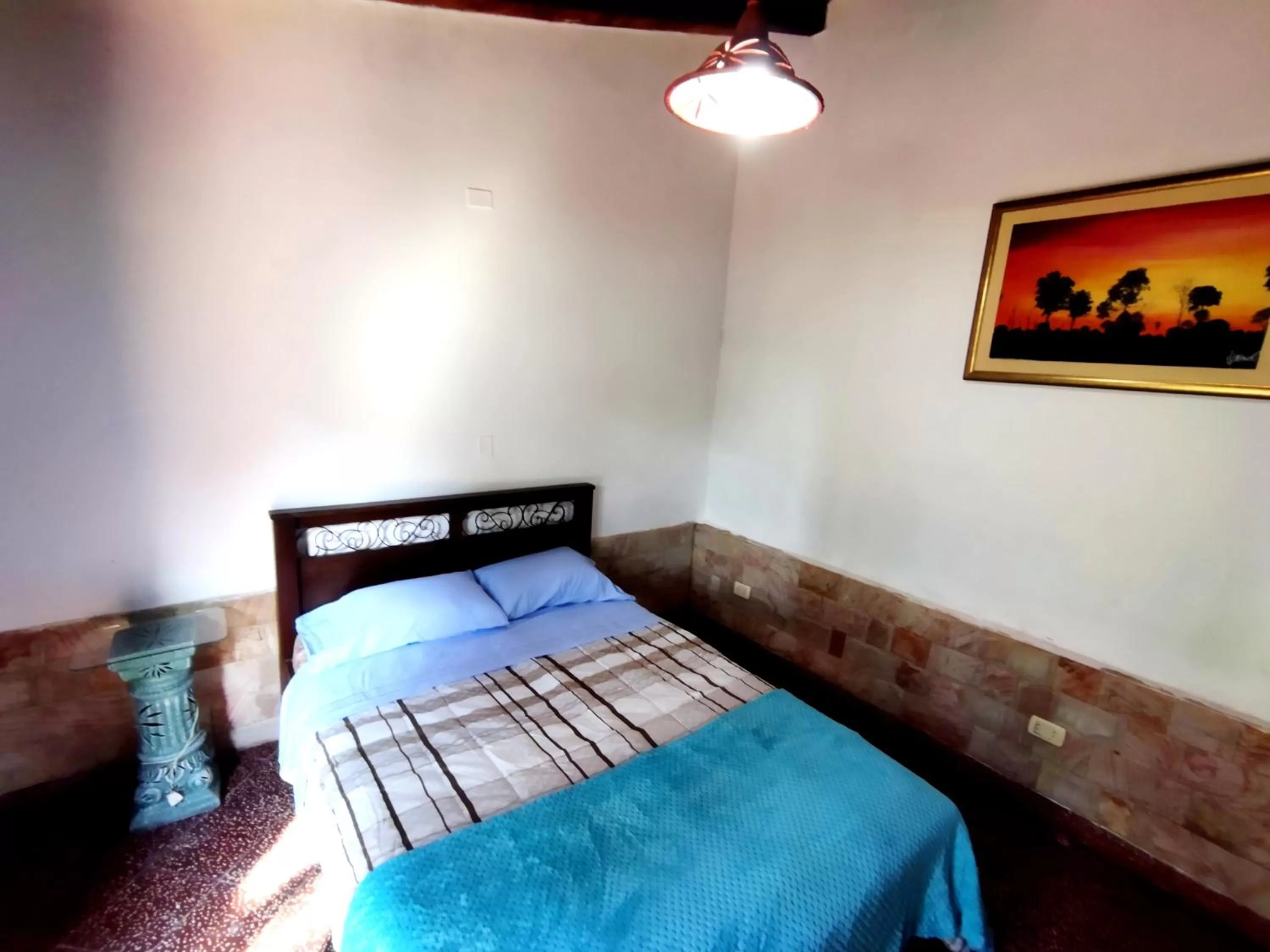 Bed in Hotel La Aparesida