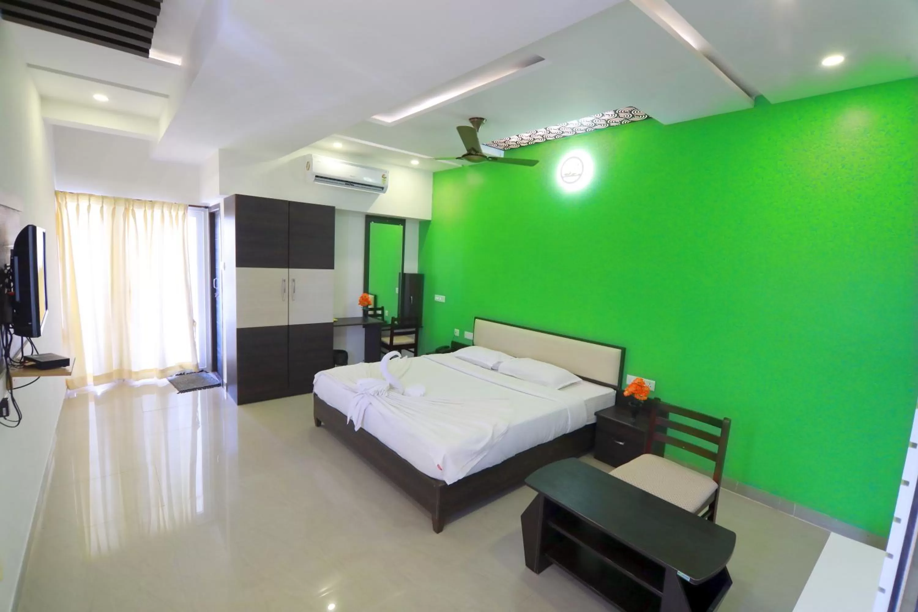 Bed in Hotel Ambai Grand