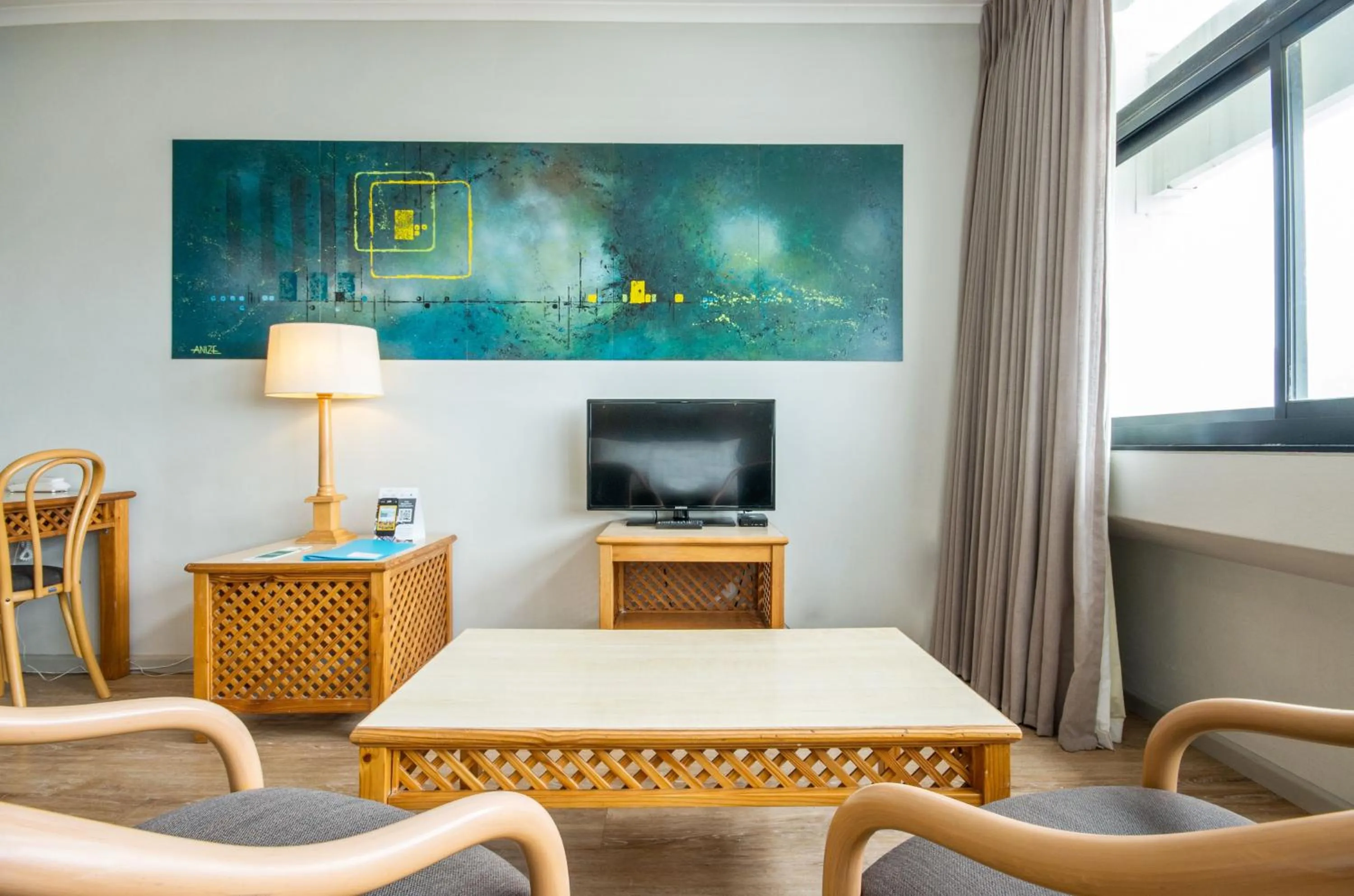 Seating area in Gardens Centre Holiday Apartments