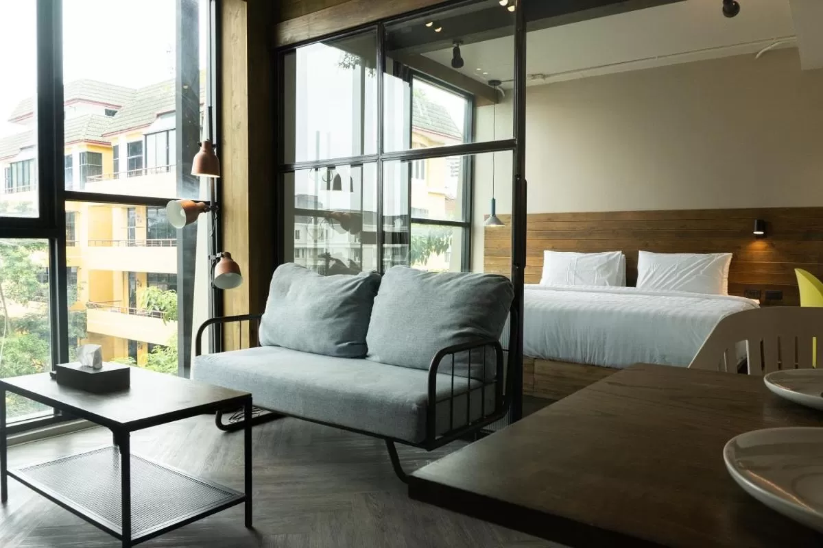 Seating area, Bed in karaarom hotel