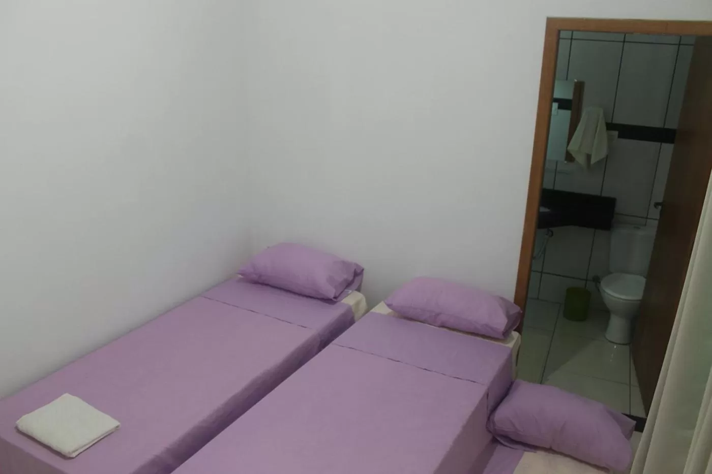 Bed in Pousada Orquideas de Maria