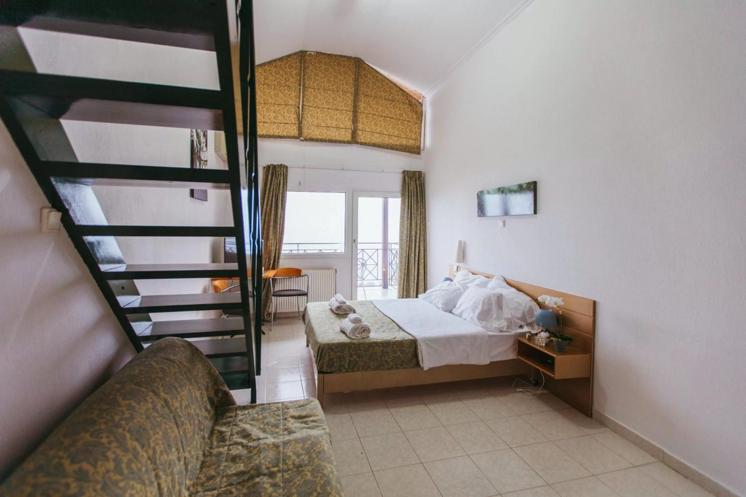 Bedroom in Hotel Christina - Happy Days