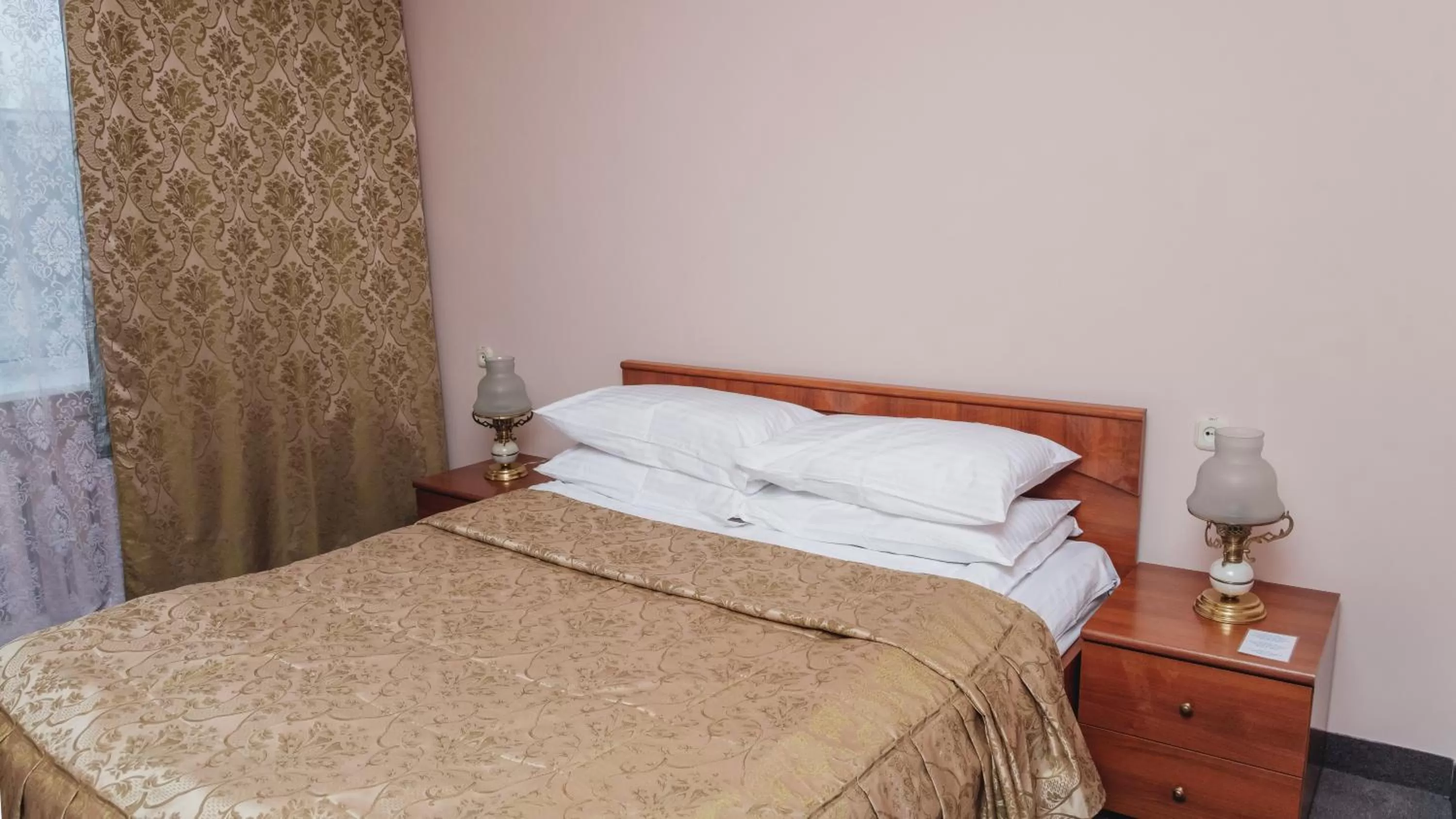 Bed in Aktobe Hotel