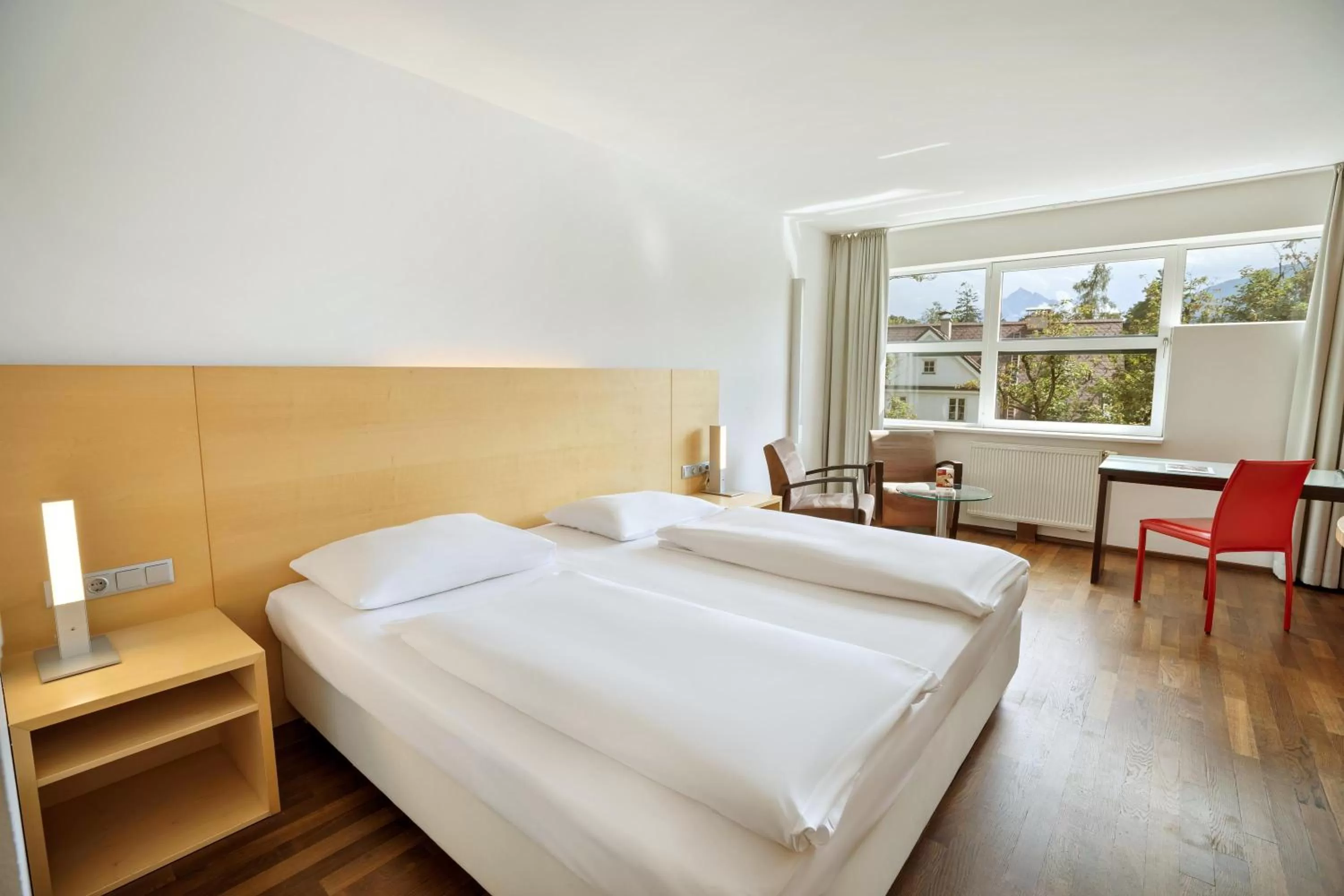 Photo of the whole room, Bed in Austria Trend Hotel Congress Innsbruck