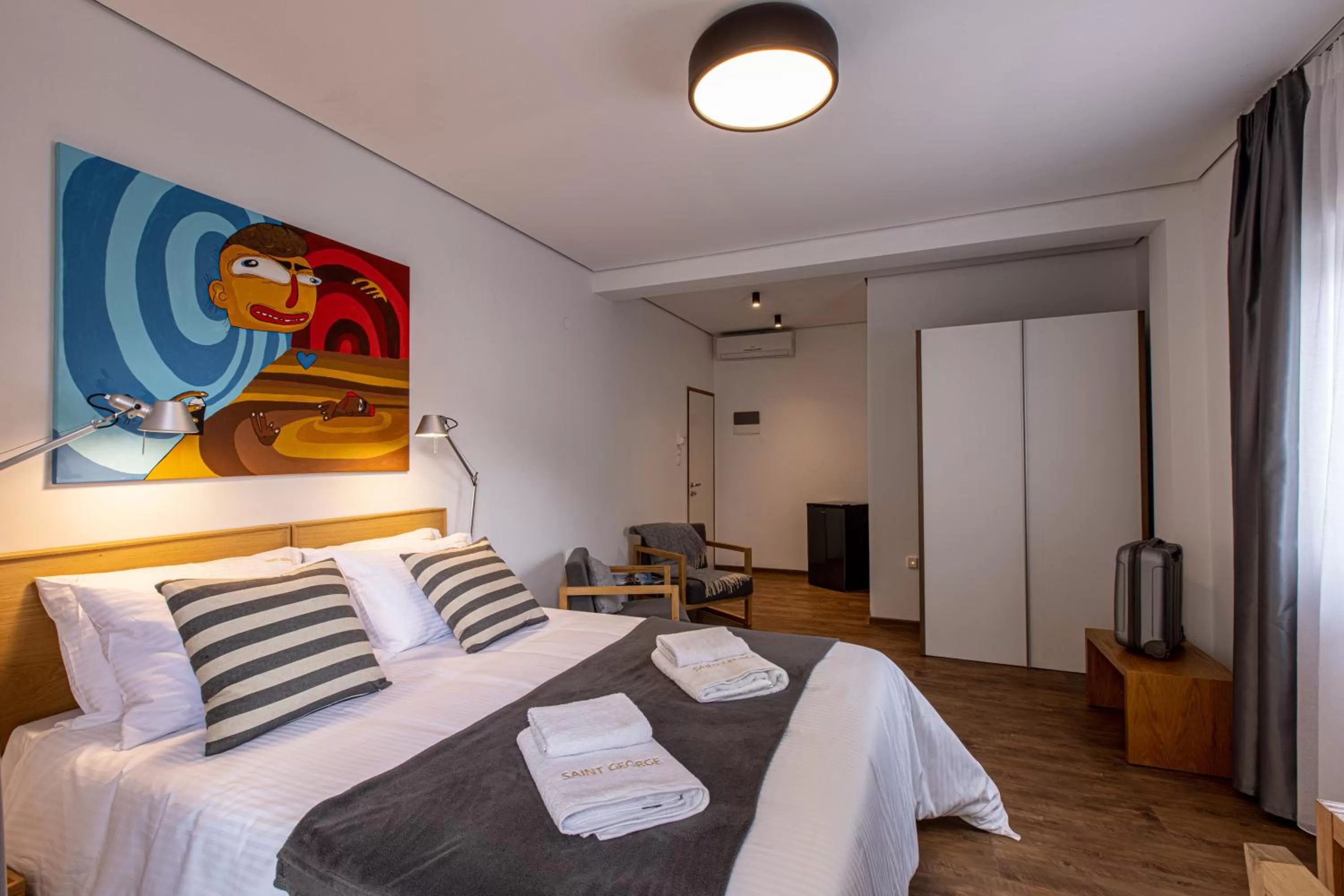 Bed in Saint George Boutique Rooms