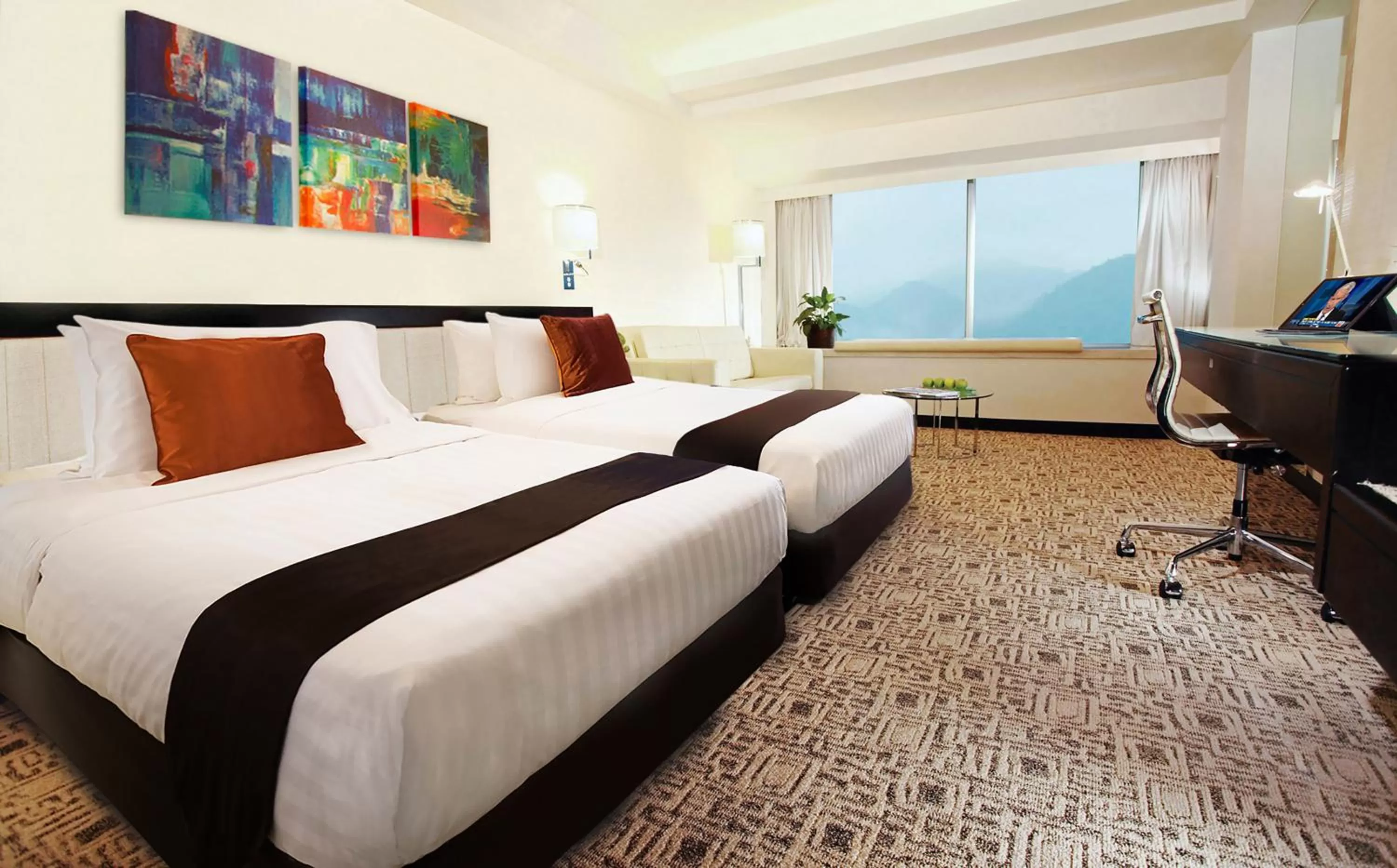 Bed in Regal Riverside Hotel