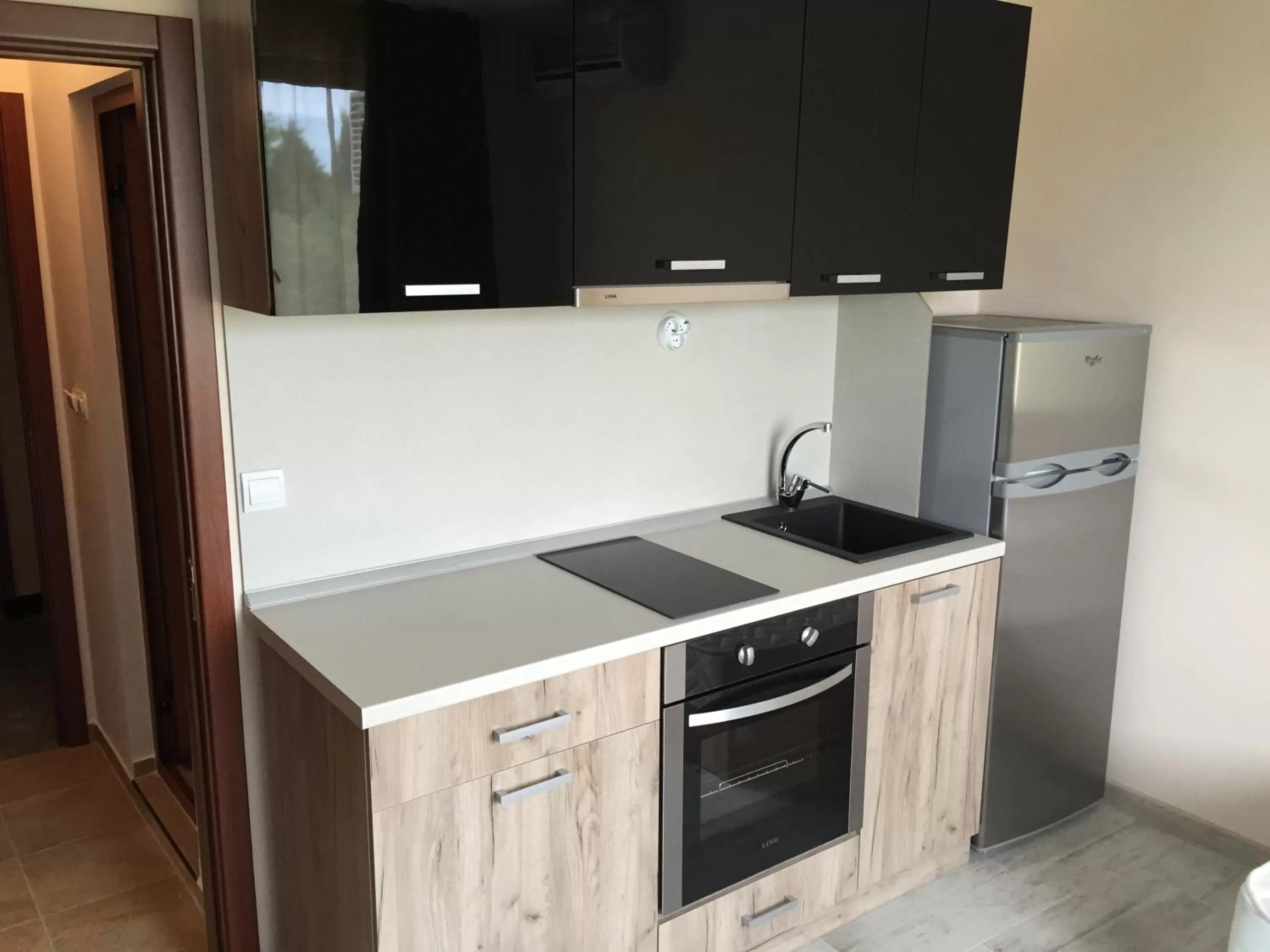 Kitchen/Kitchenette in Family Hotel Malibu