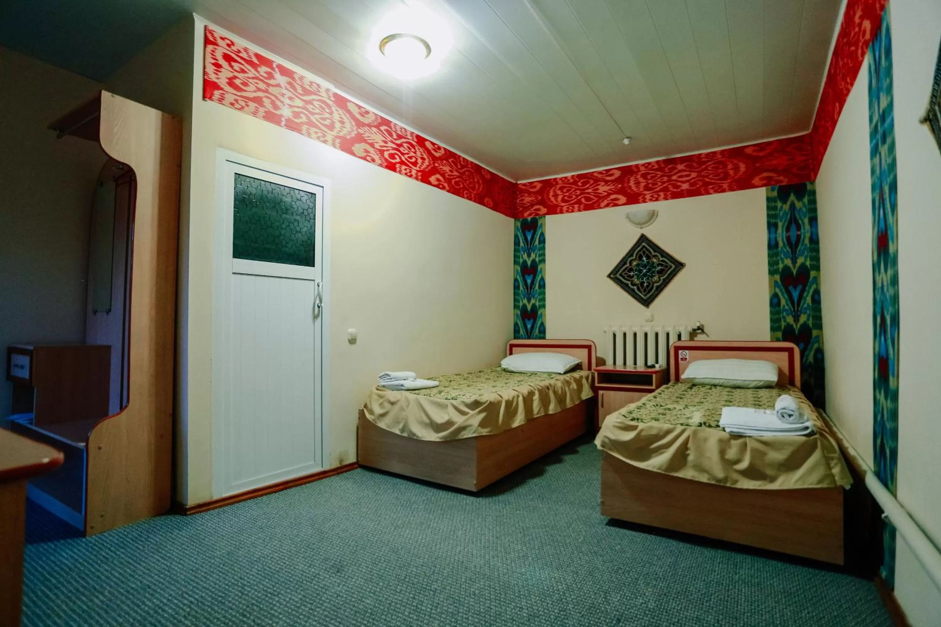 Photo of the whole room, Bed in Bukhara house hotel