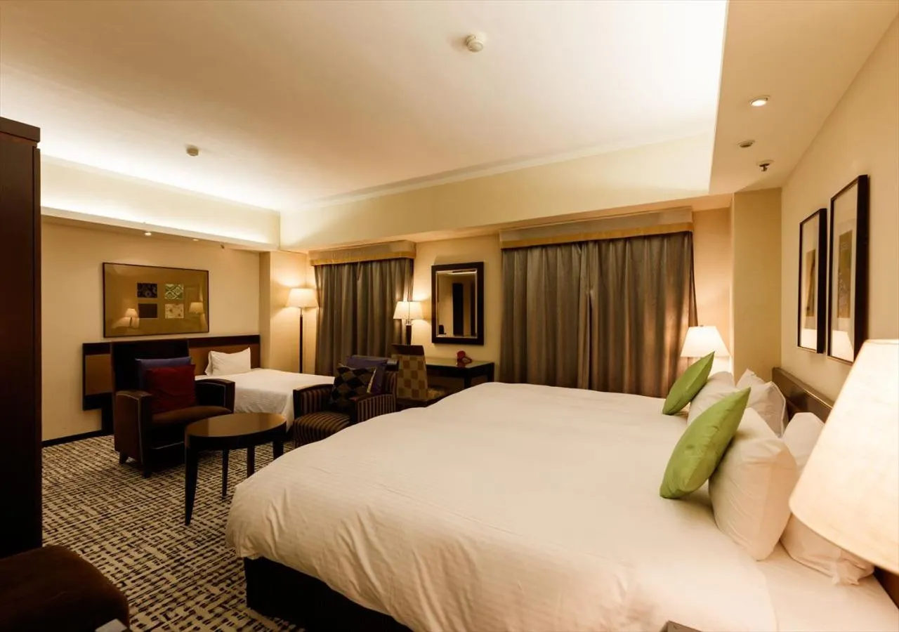 Bed in Kanazawa New Grand Hotel Prestige