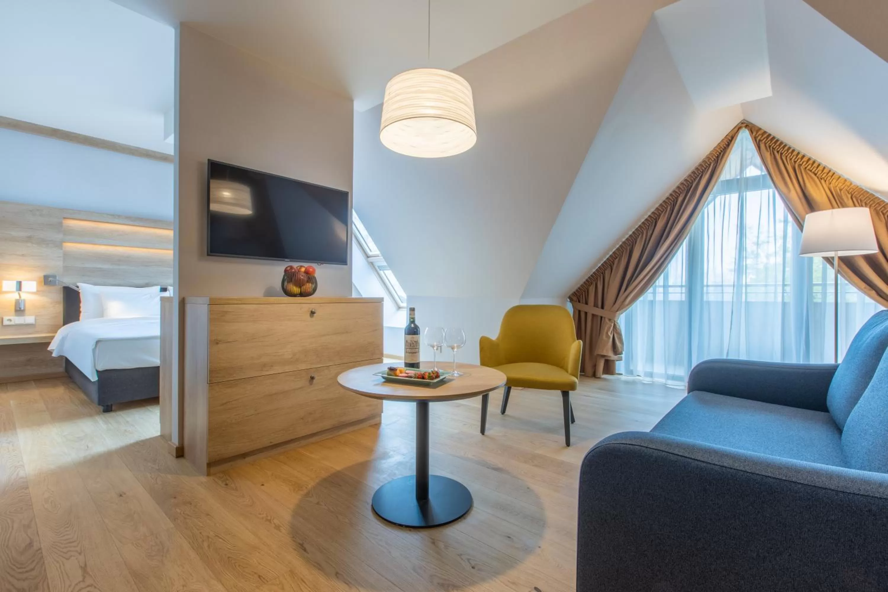 Living room, Bed in Radisson Blu Hotel & Residences