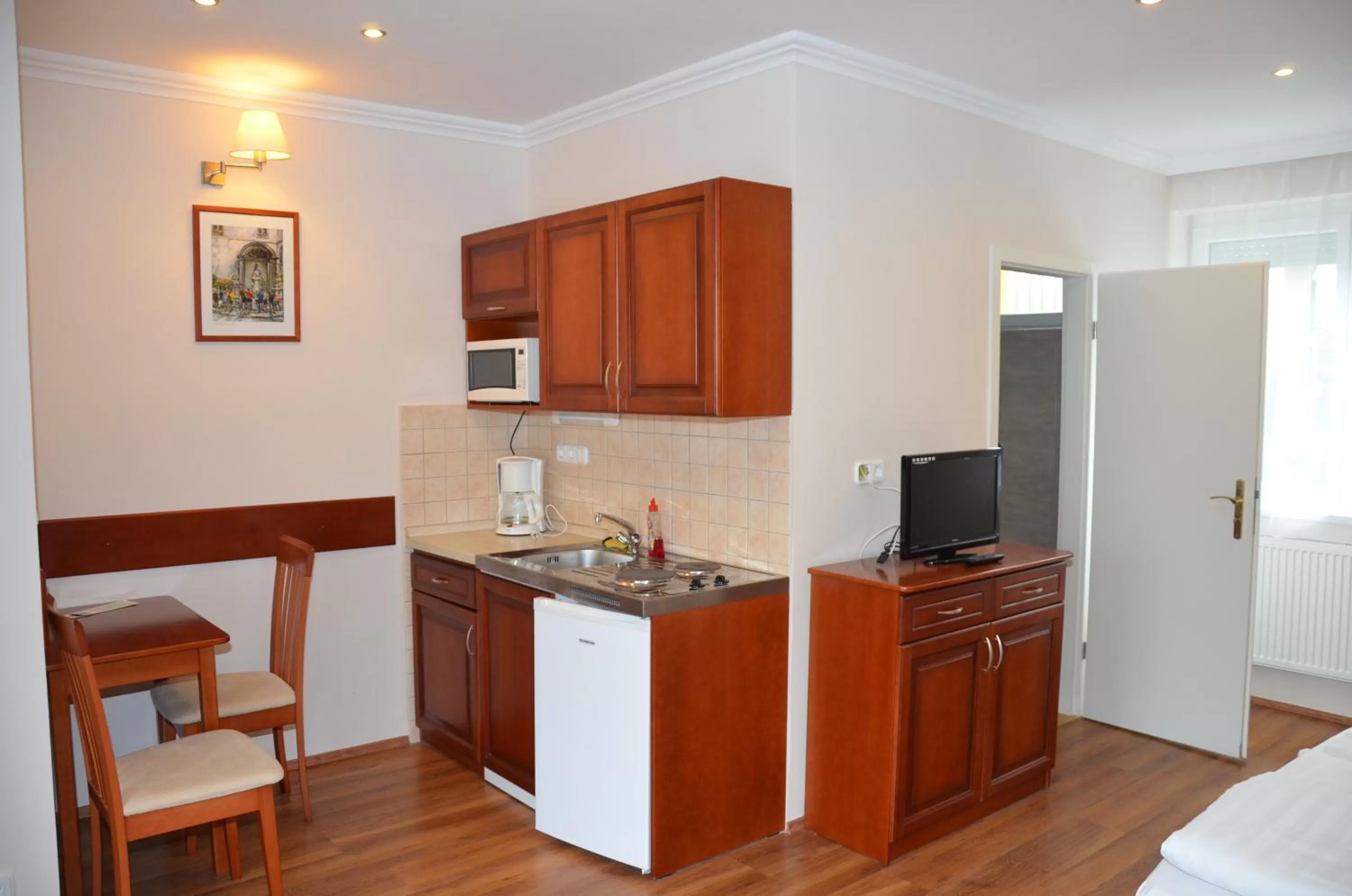 Kitchen or kitchenette in Szieszta Panzió