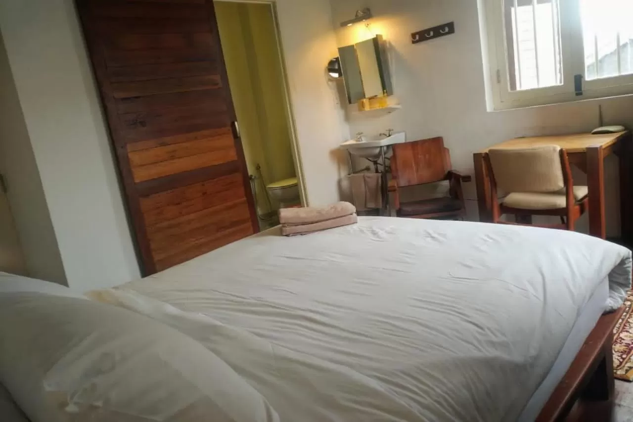 Bed in Ren I Tang Heritage Inn