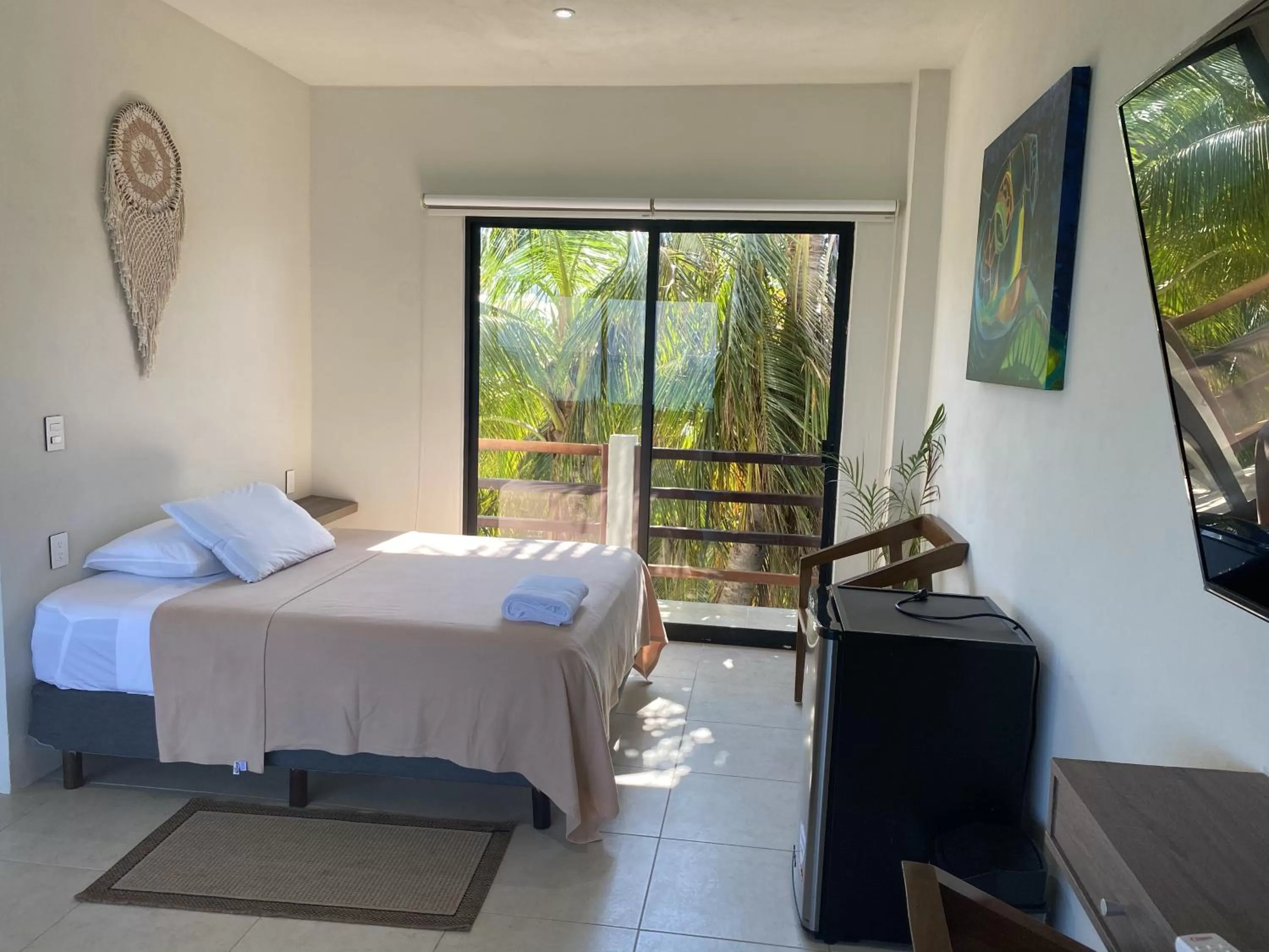 Photo of the whole room, Bed in Cuxos Hotel Beachfront