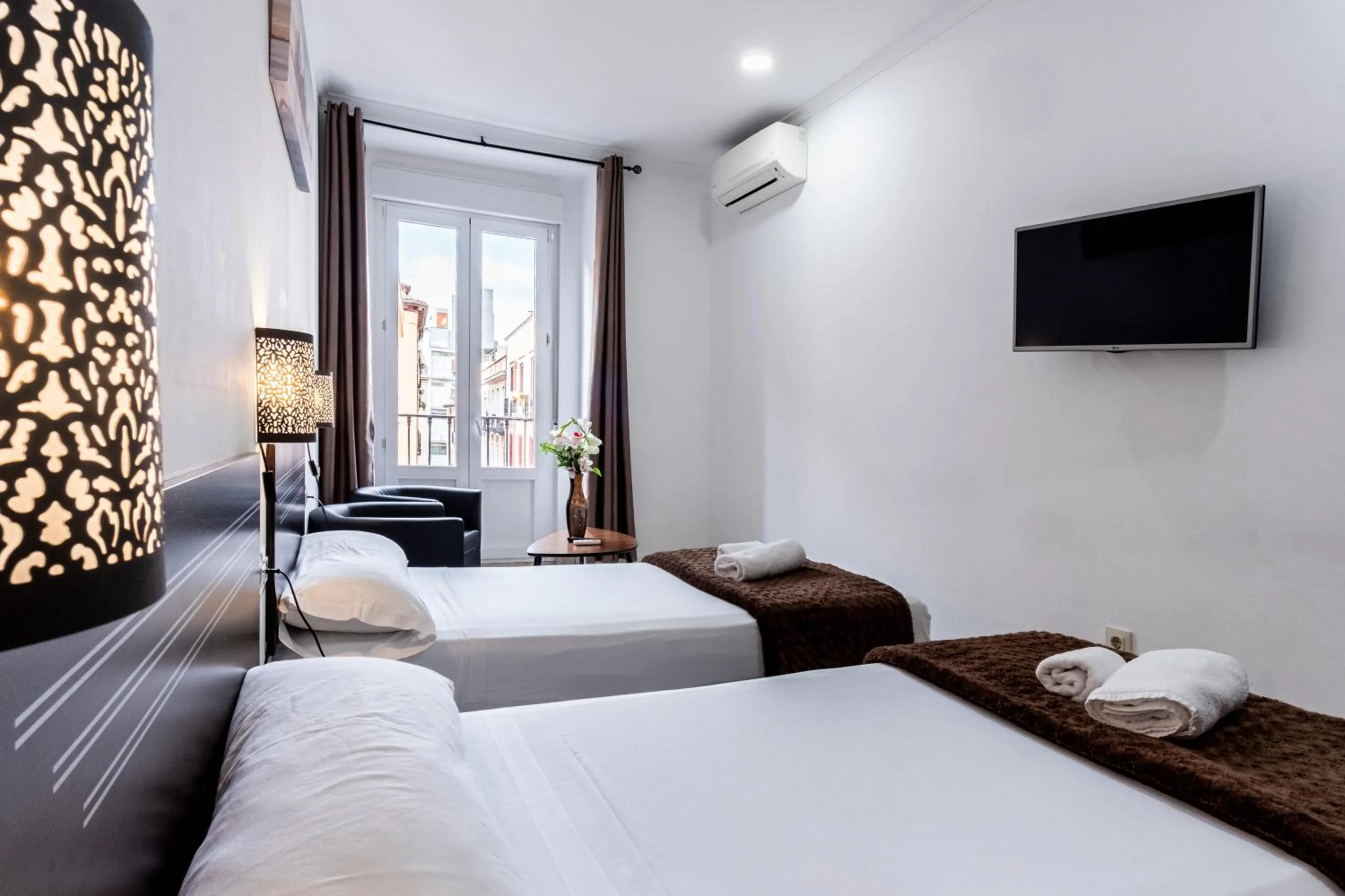 Photo of the whole room, Bed in Hostal Rincón de Sol - Centro Madrid - Self Checkin