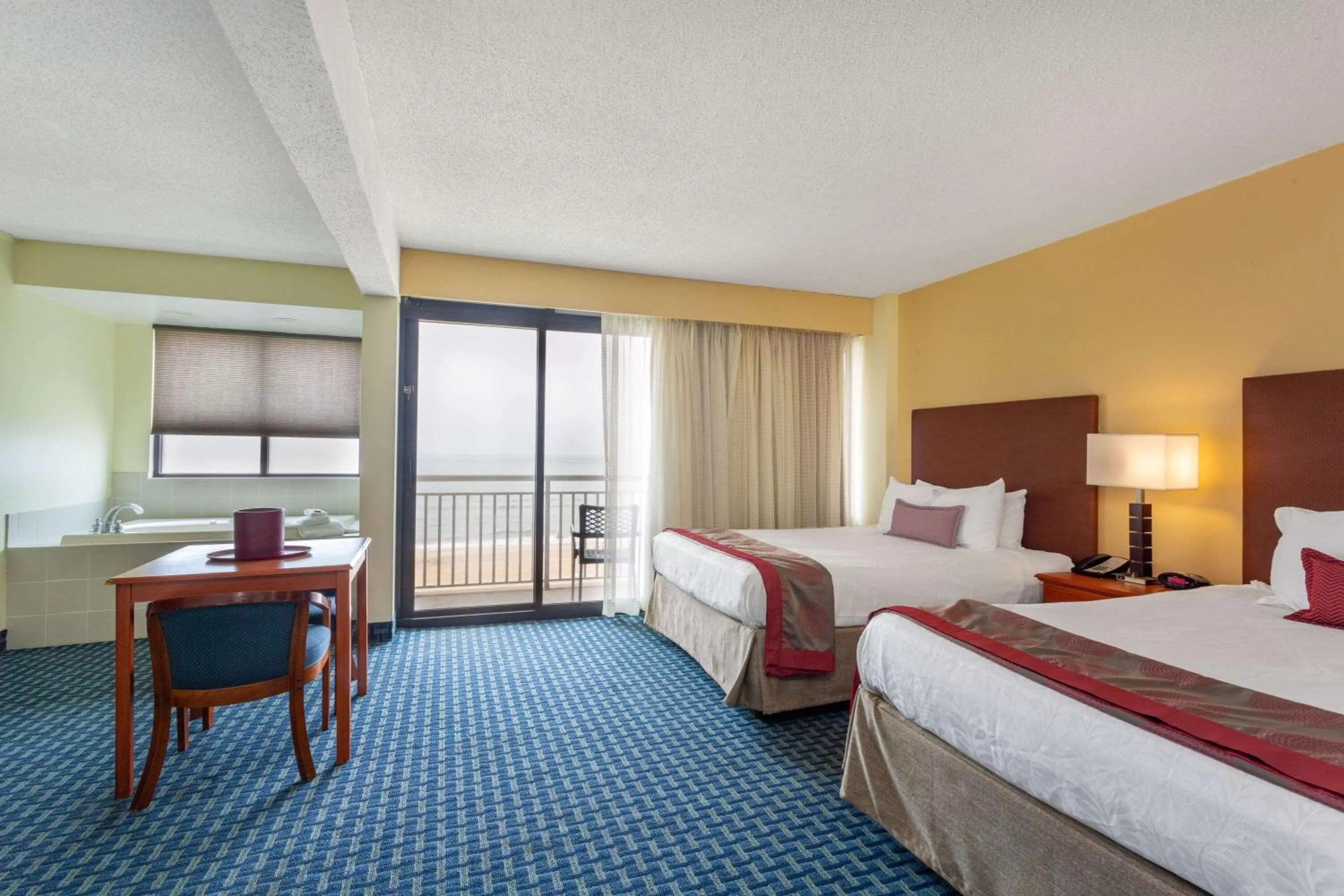 Photo of the whole room, Bed in Ramada Plaza by Wyndham Virginia Beach Oceanfront