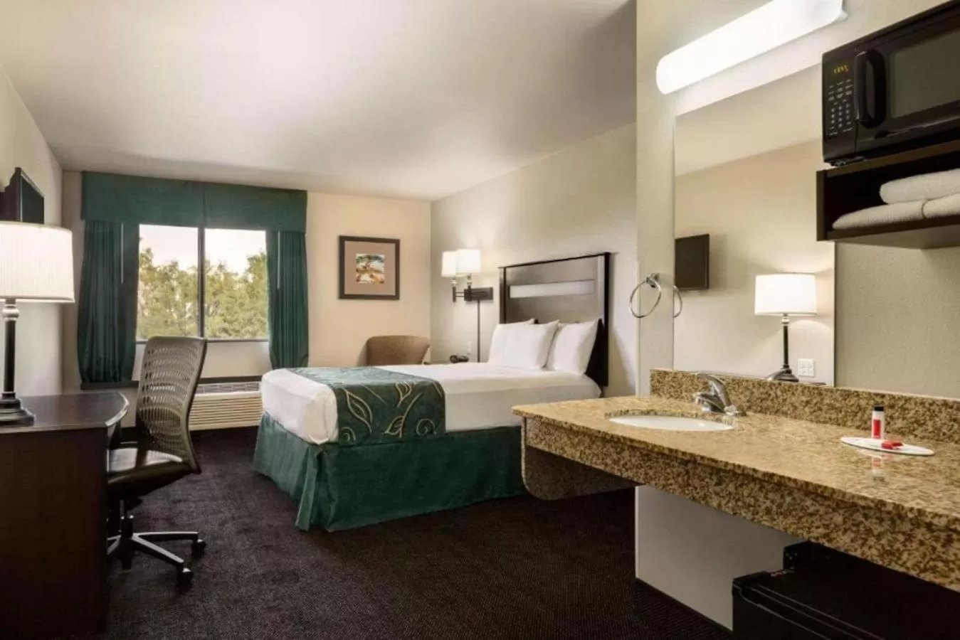 Bathroom, Bed in Travelodge by Wyndham Santa Teresa