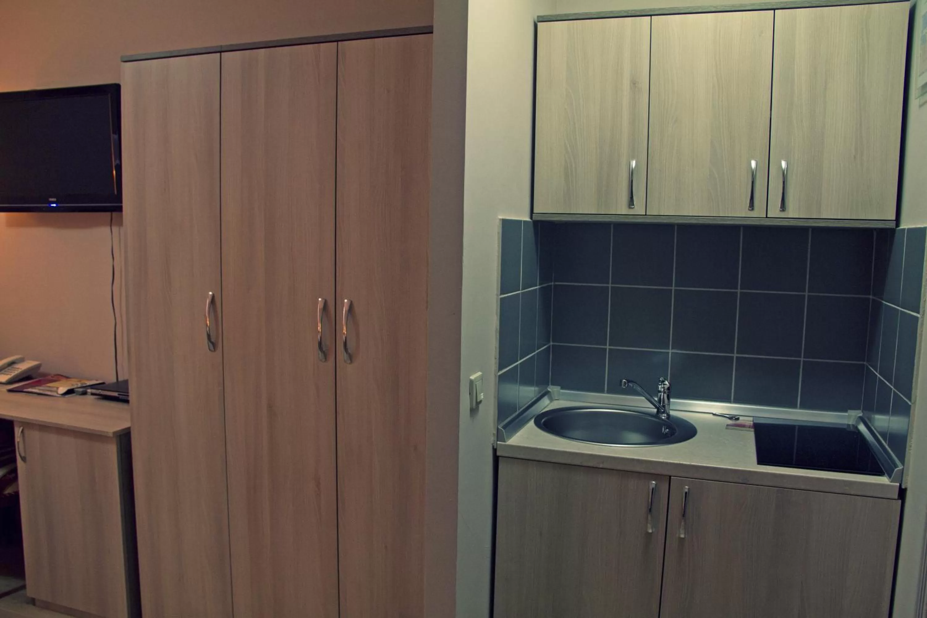 Kitchen or kitchenette in Garni Hotel Tri O