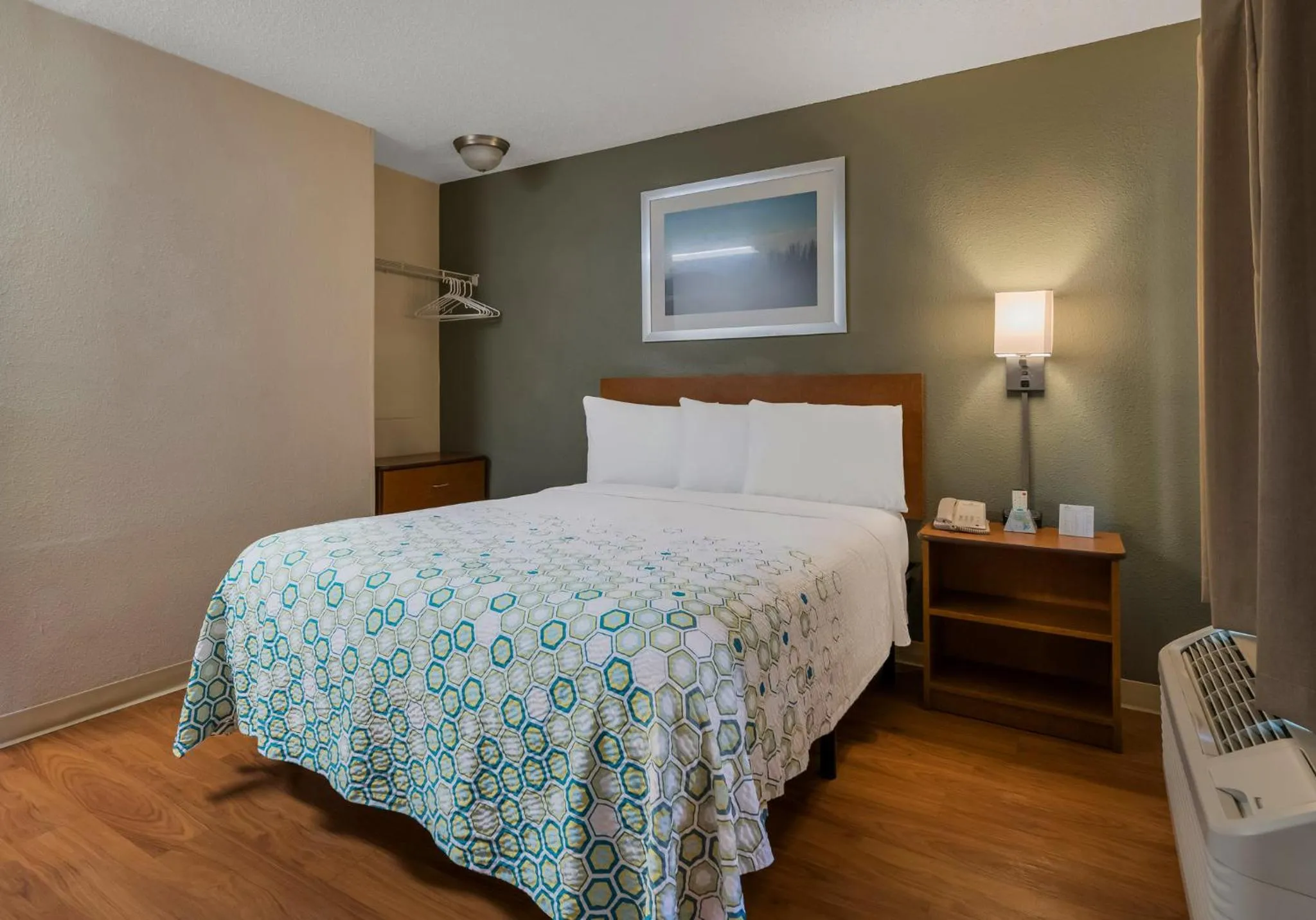 Bedroom, Bed in HomeTowne Studios by Red Roof Orlando - UCF Area