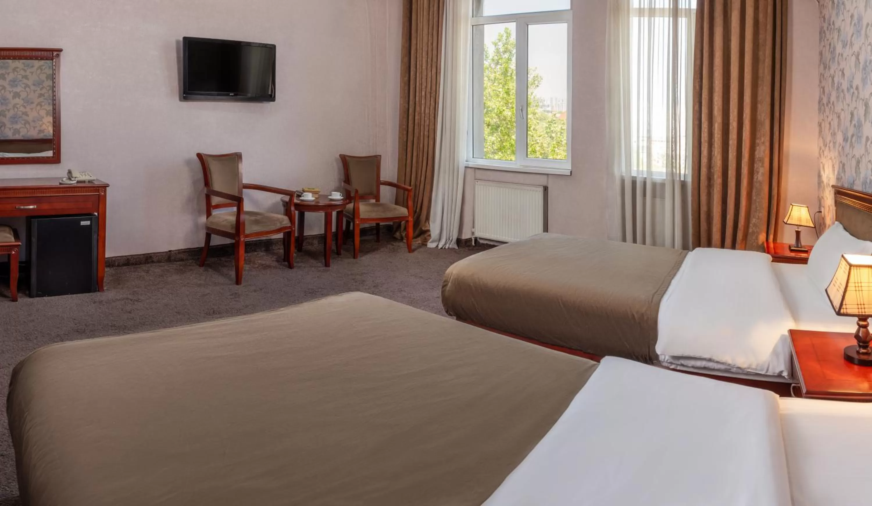 Communal lounge/ TV room in Margo Palace Hotel