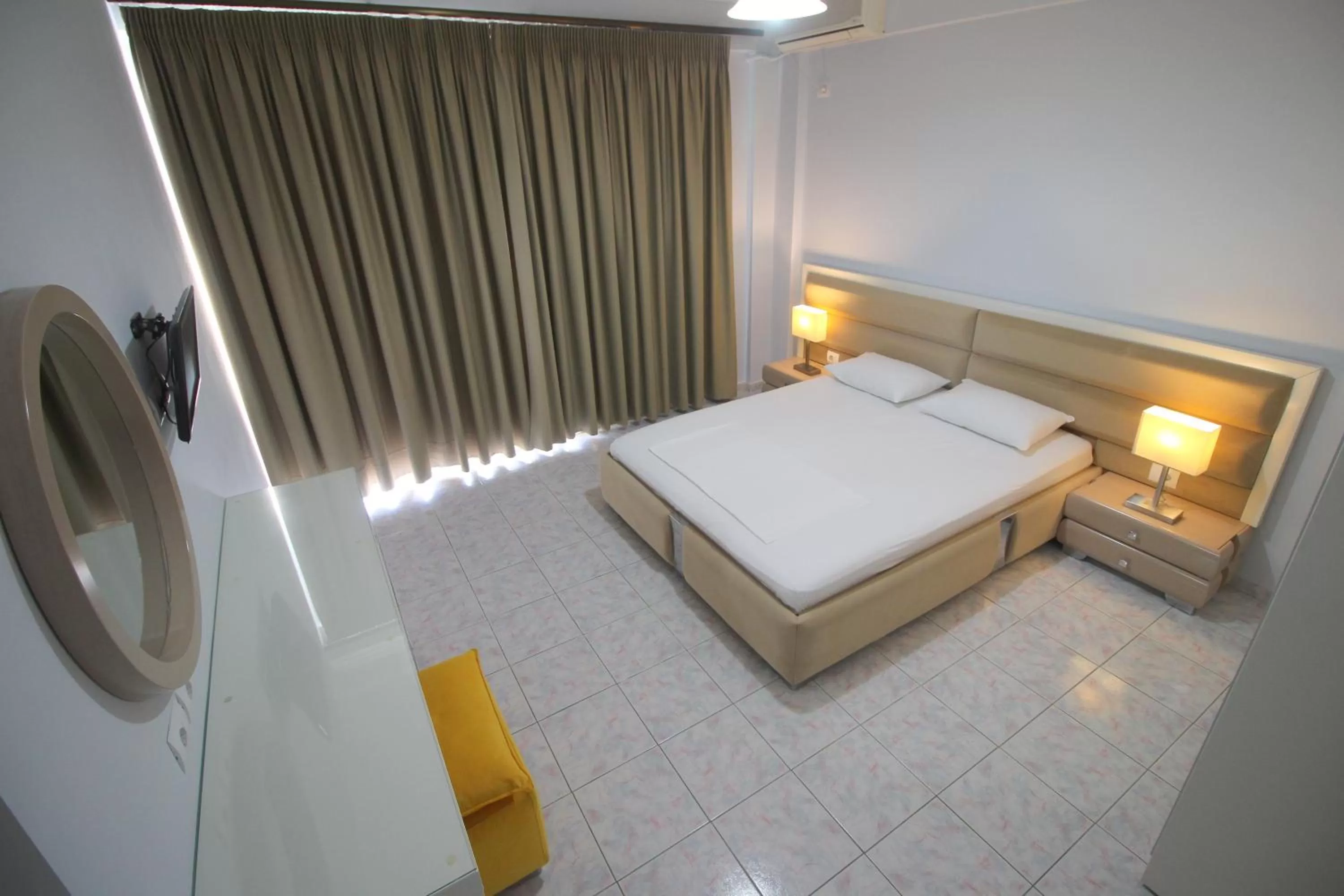 Bed in Murati Suites Sarandë