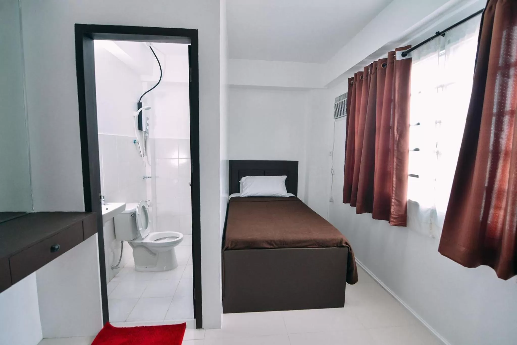 Bedroom, Bed in The Strand Suites and Dormitel