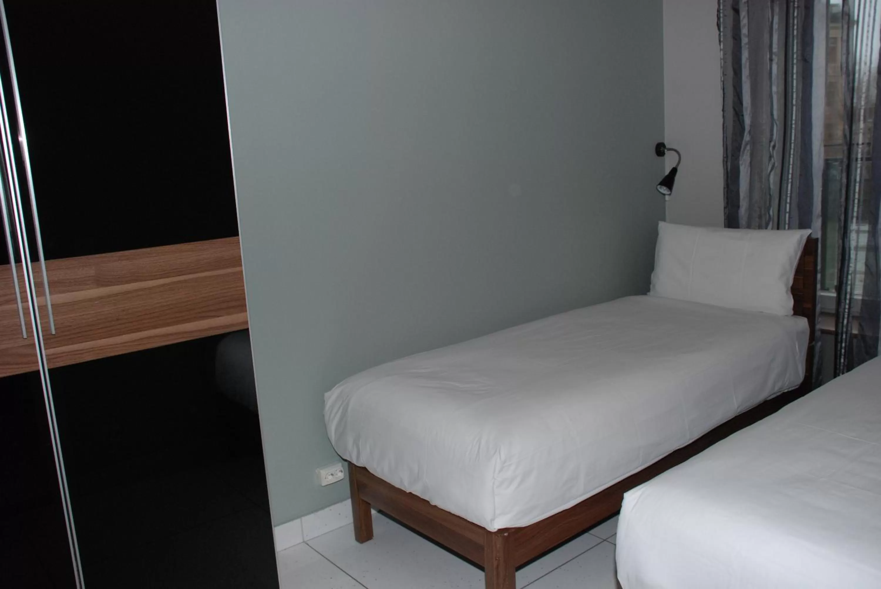 Bed in Central City Apartments