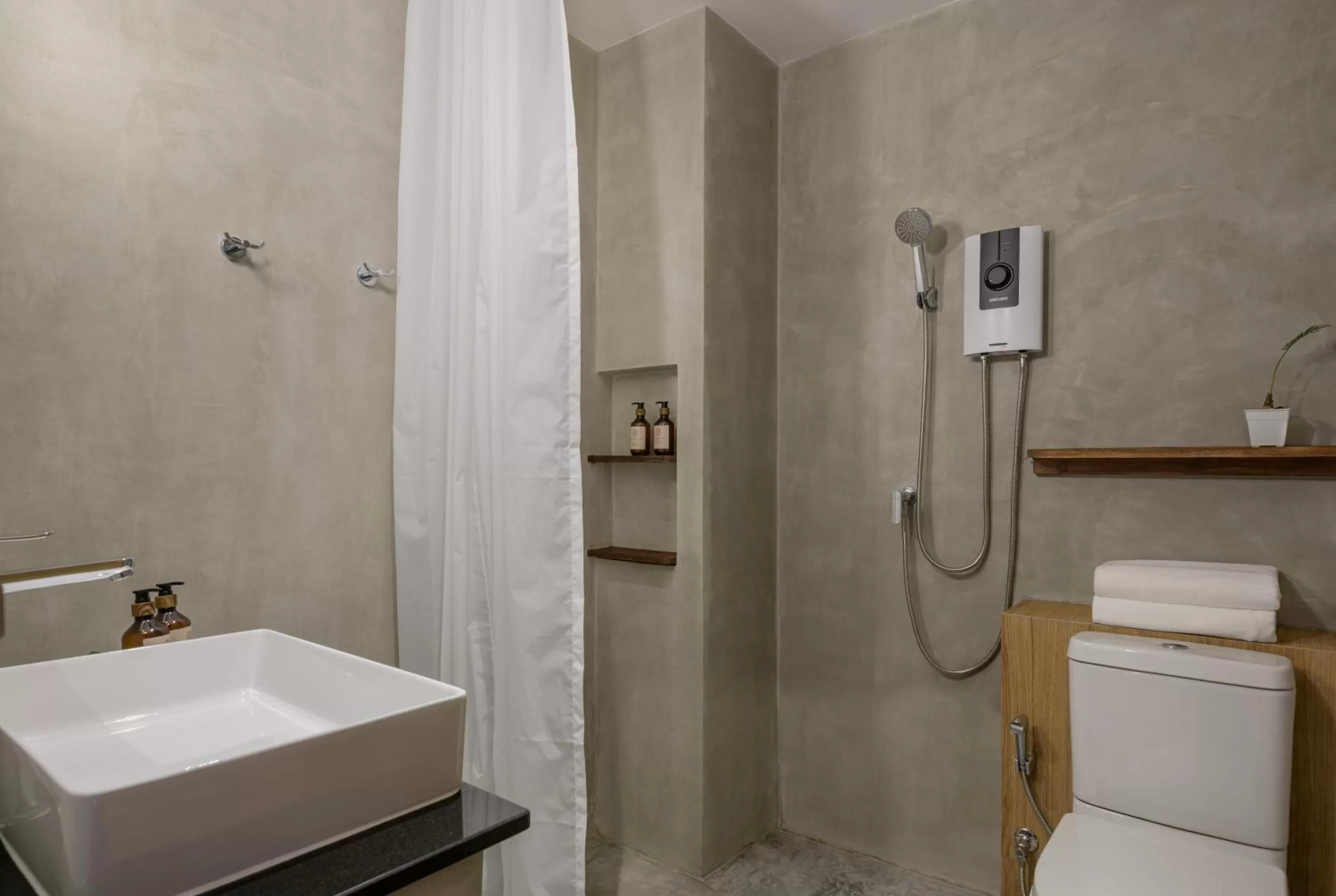 Bathroom in The Motifs Eco Hotel - SHA Extra Plus