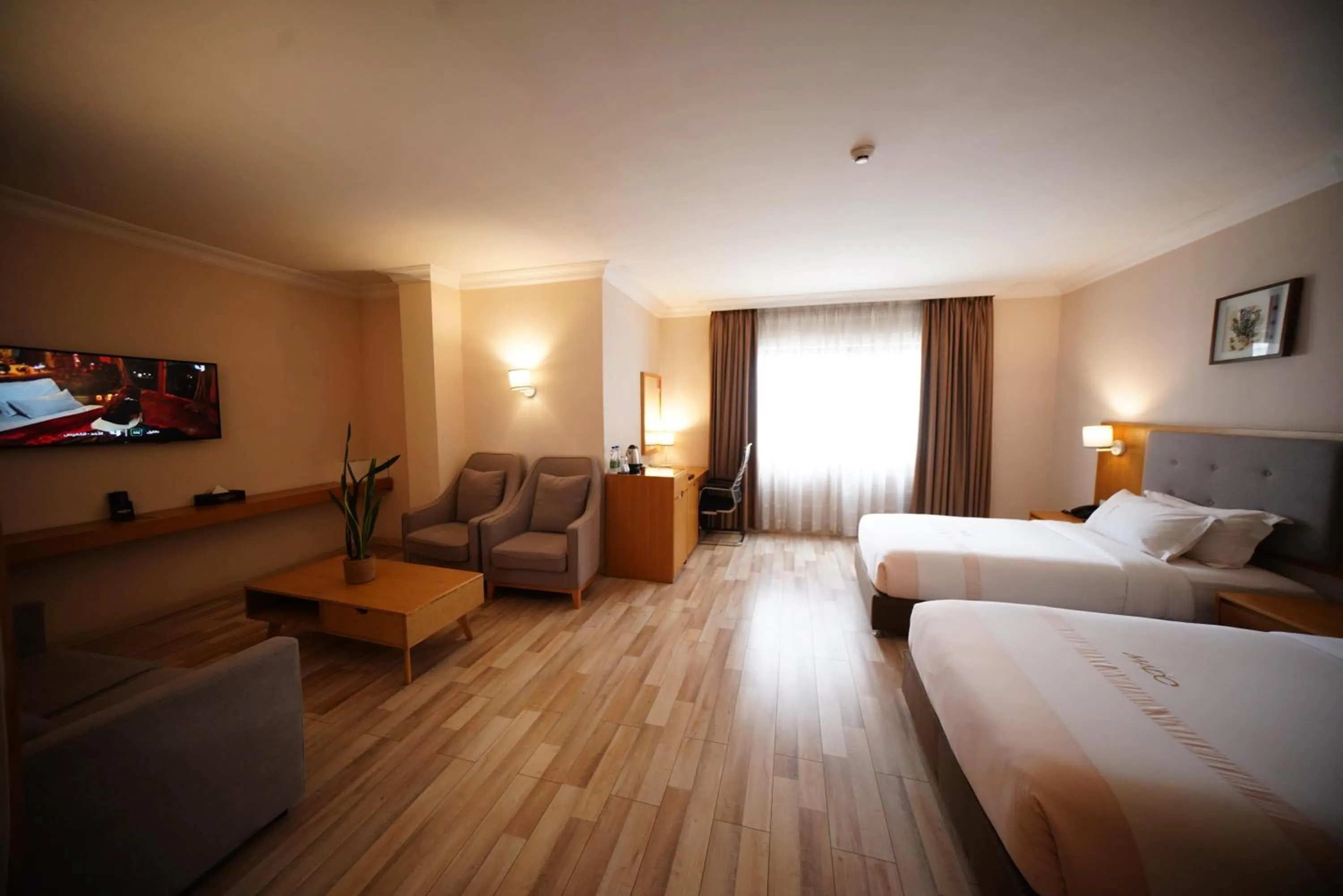 Living room, Bed in Mado Hotel