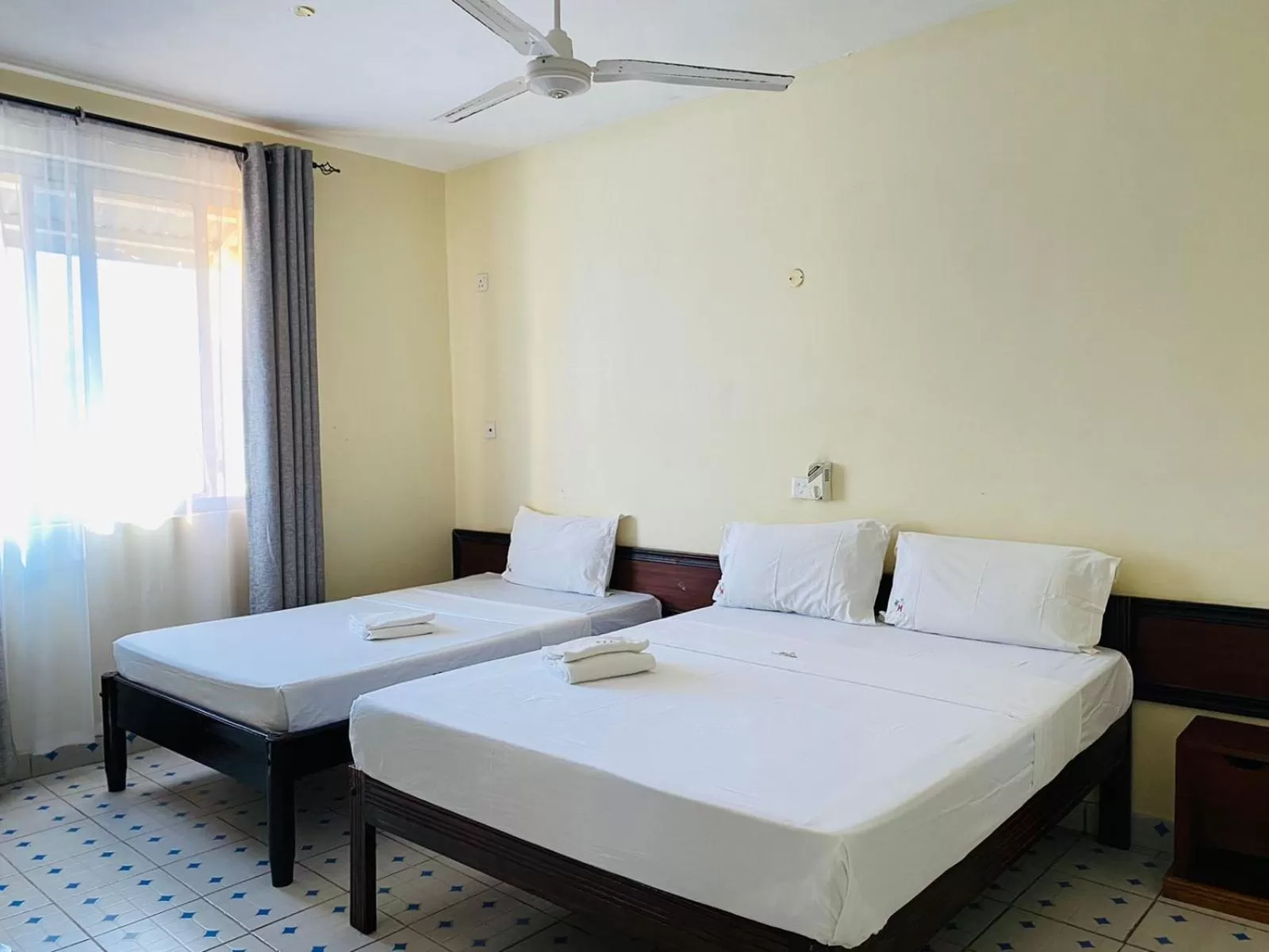 Bed in Merry Villa Hotel & Apartments