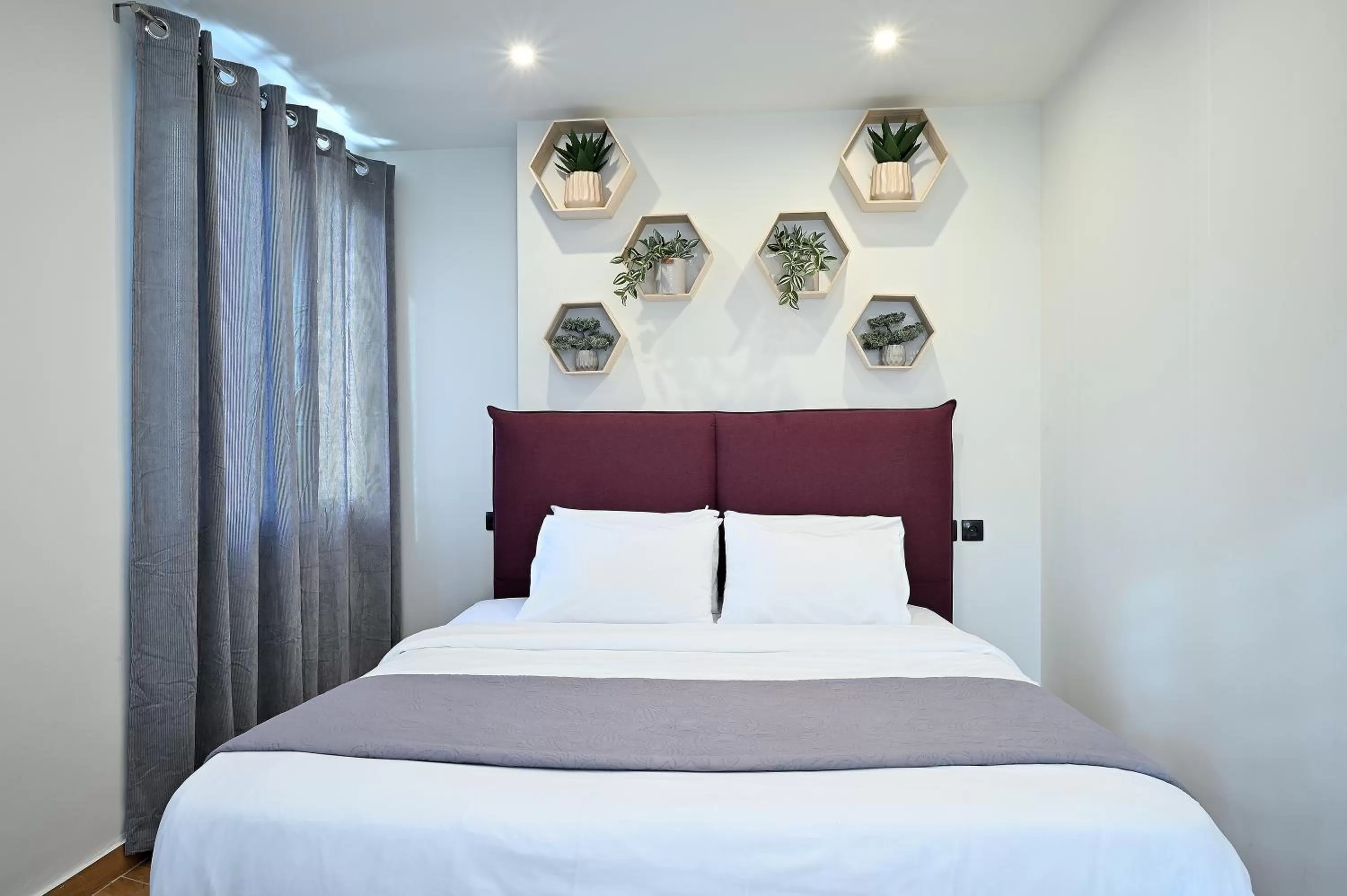 Bed in The Athens Version Luxury Suites