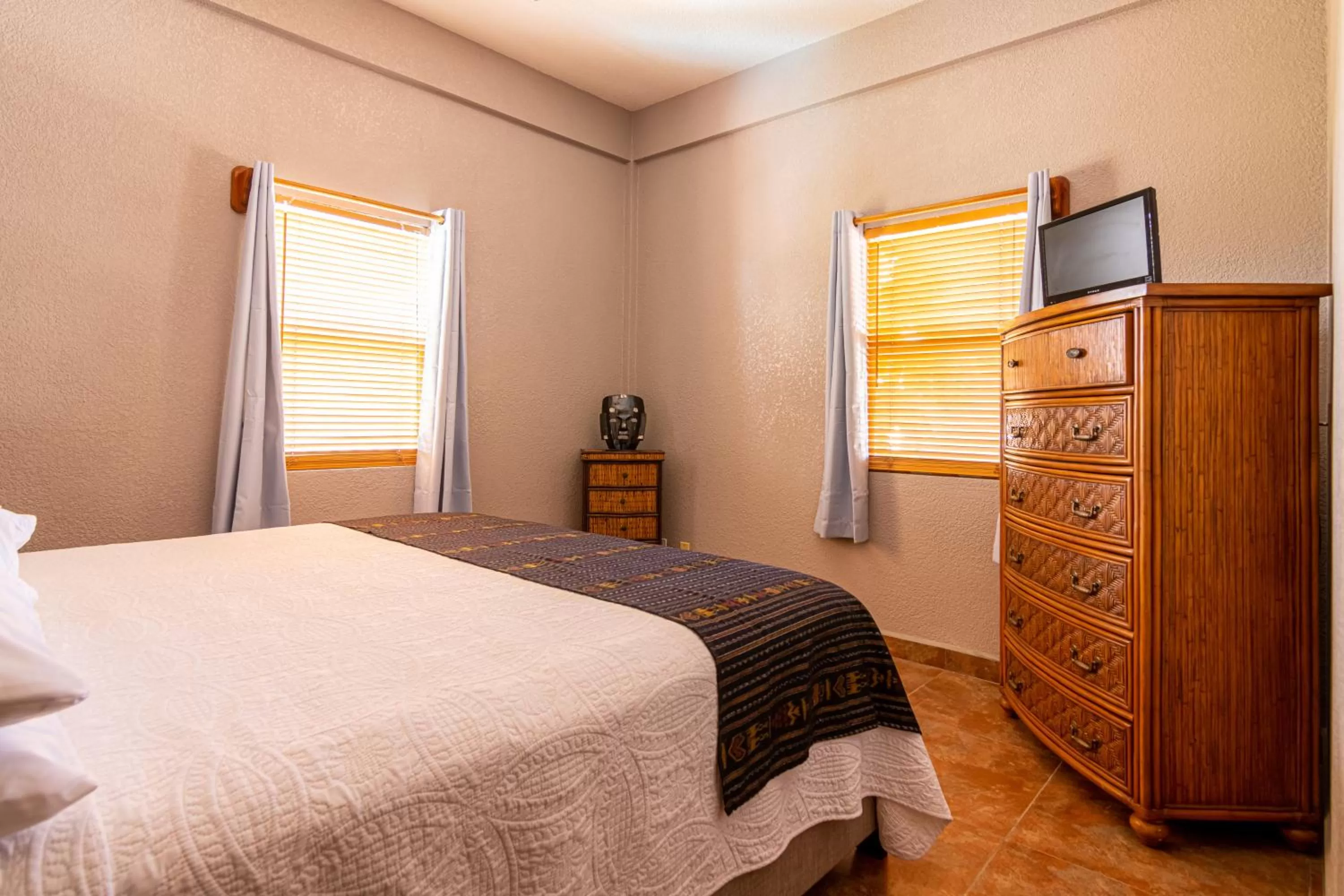 Bed in Lighthouse Beach Villas