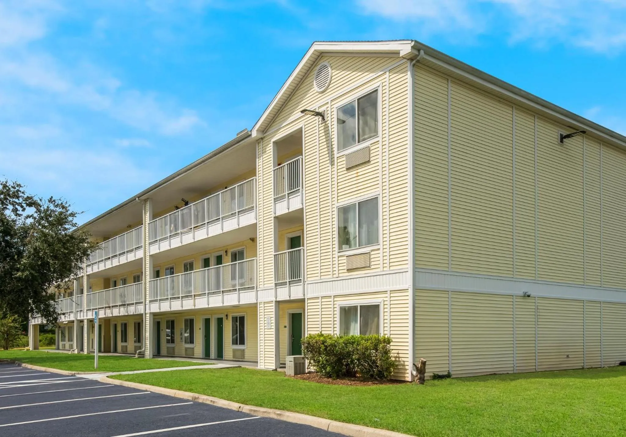 Property building in HomeTowne Studios by Red Roof Orlando - UCF Area