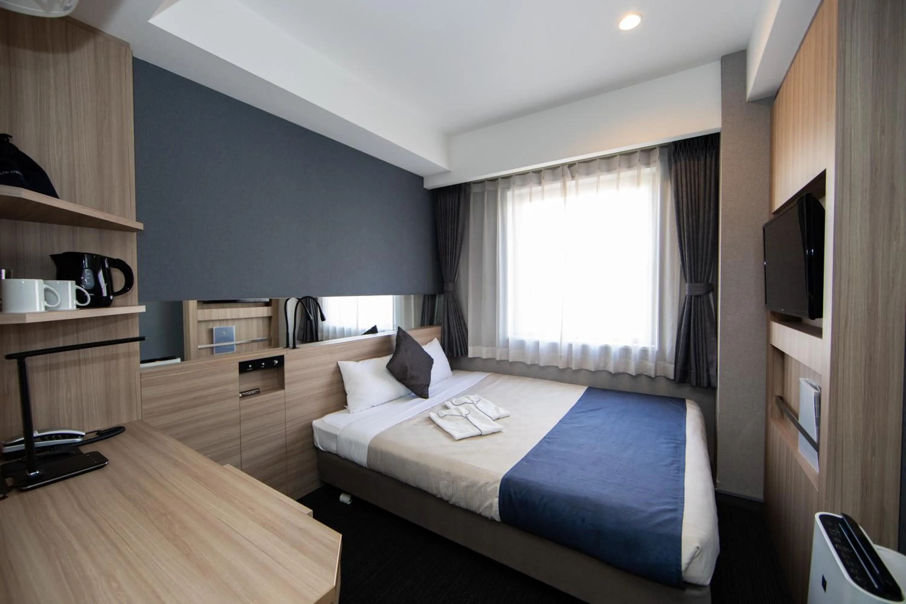 Photo of the whole room, Bed in Quintessa Hotel Osaka Shinsaibashi Comic & Books