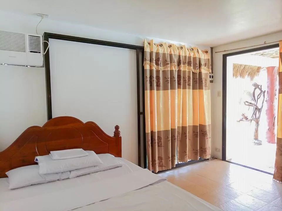 Bed in Camaya-an Paradise Beach Resort